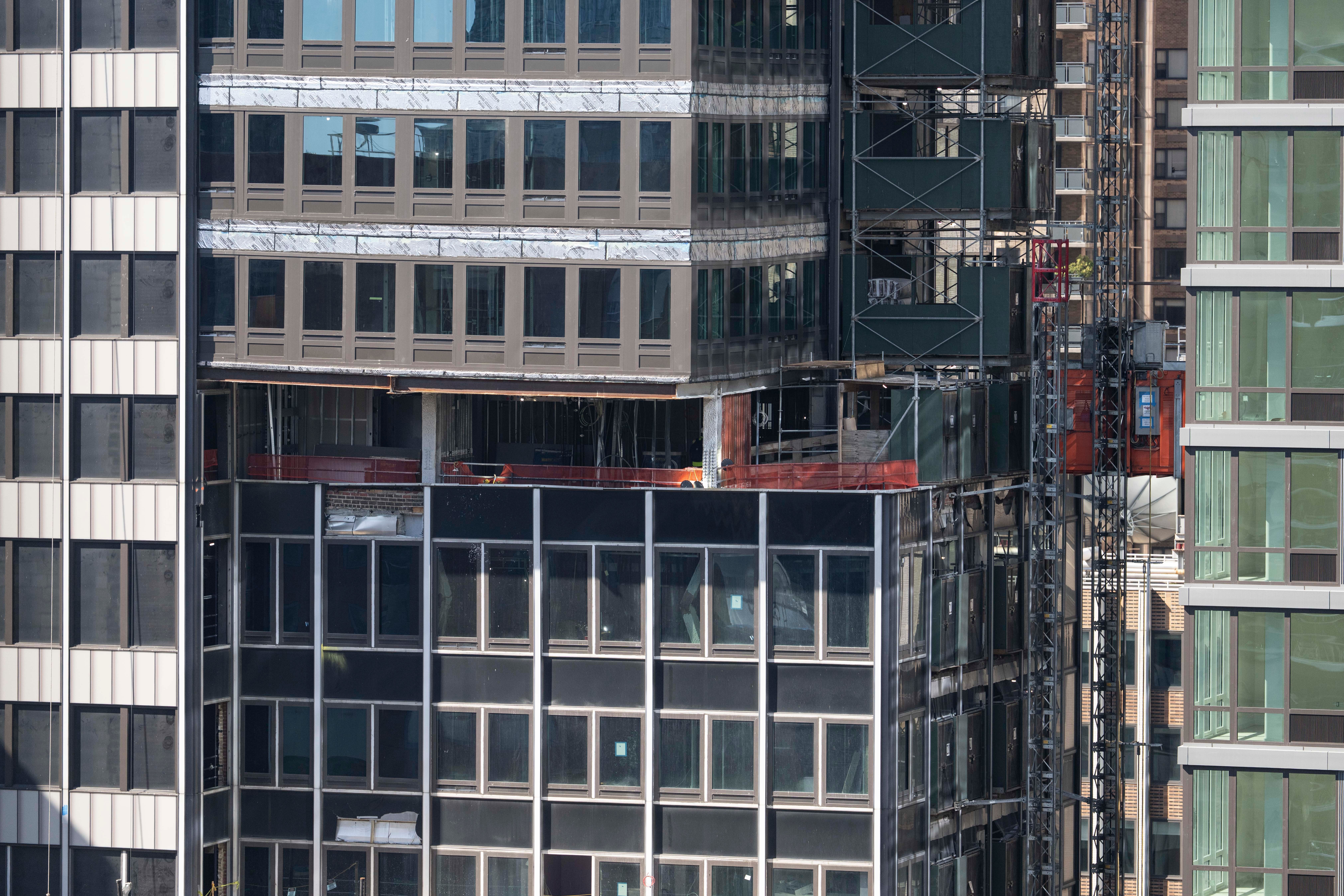 The building, located on 42nd Street, faced complaints about falling debris. It was evacuated on Tuesday after workers found steel beams bent as renovation work was onoging