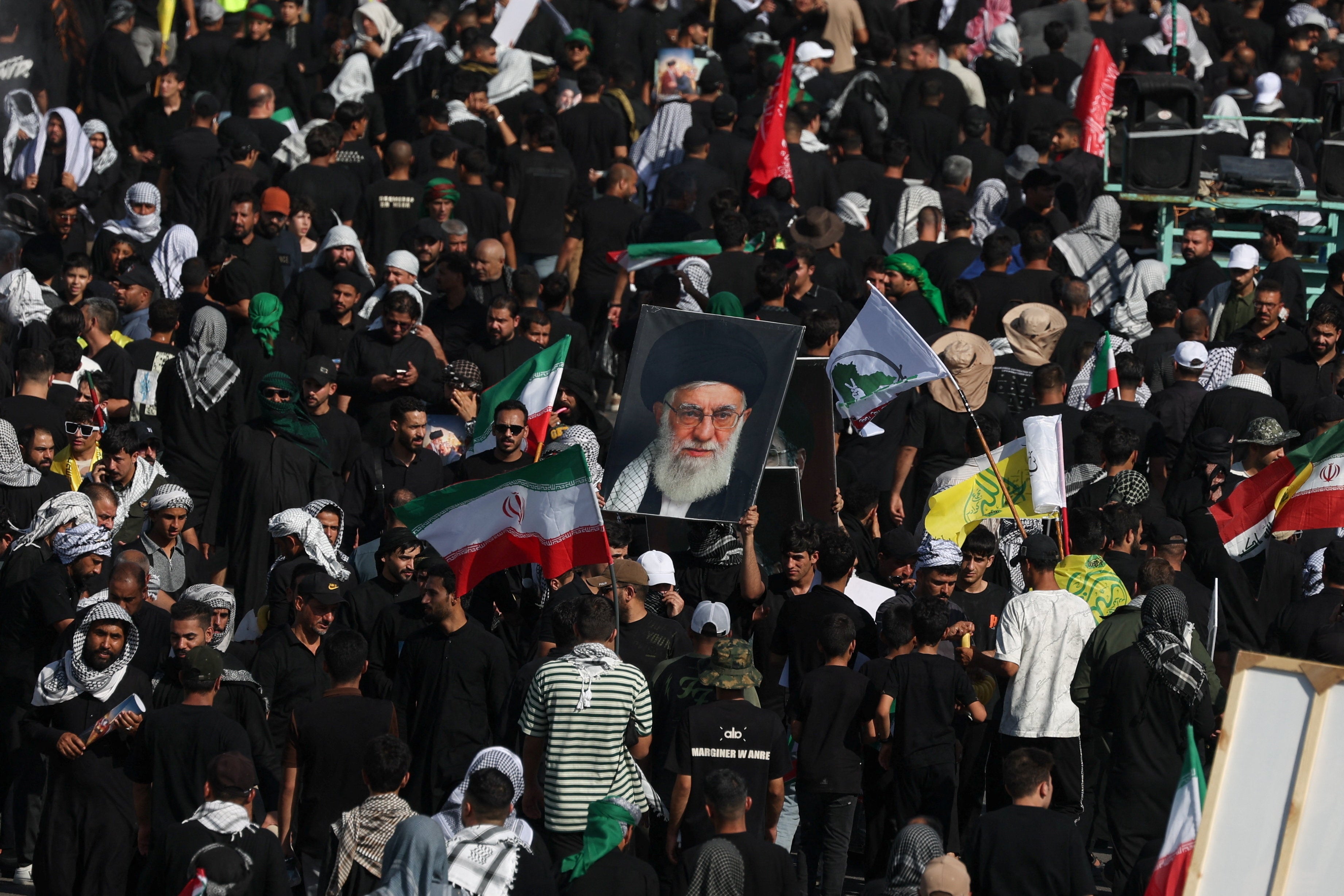 People attend a funeral procession for Iran's late Supreme Leader Ayatollah Ali Khamenei