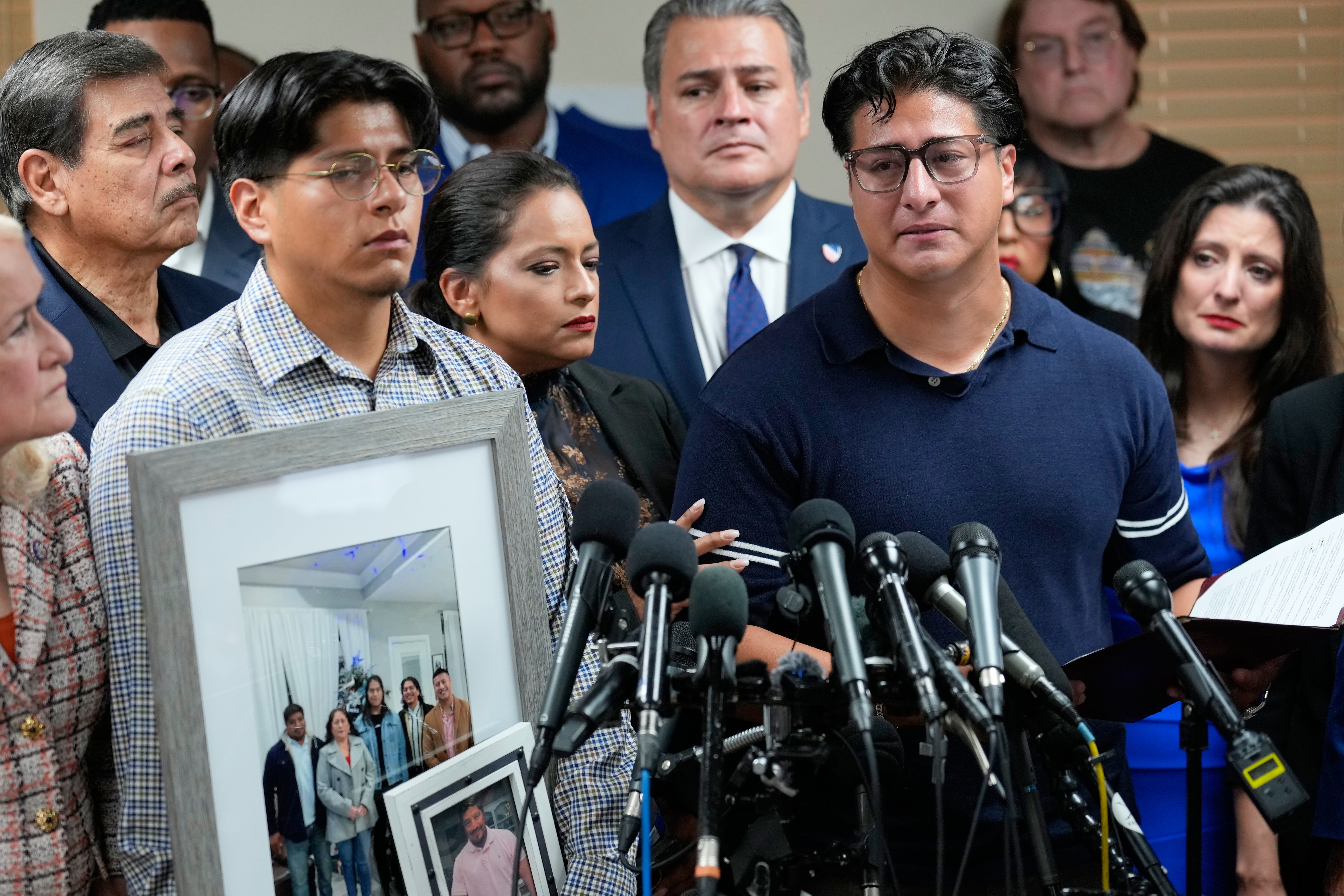 ‘My father did not deserve this,’ Ronaldo Salgado (right) said. ‘He just wanted to go to work and come back to us’ (AP)