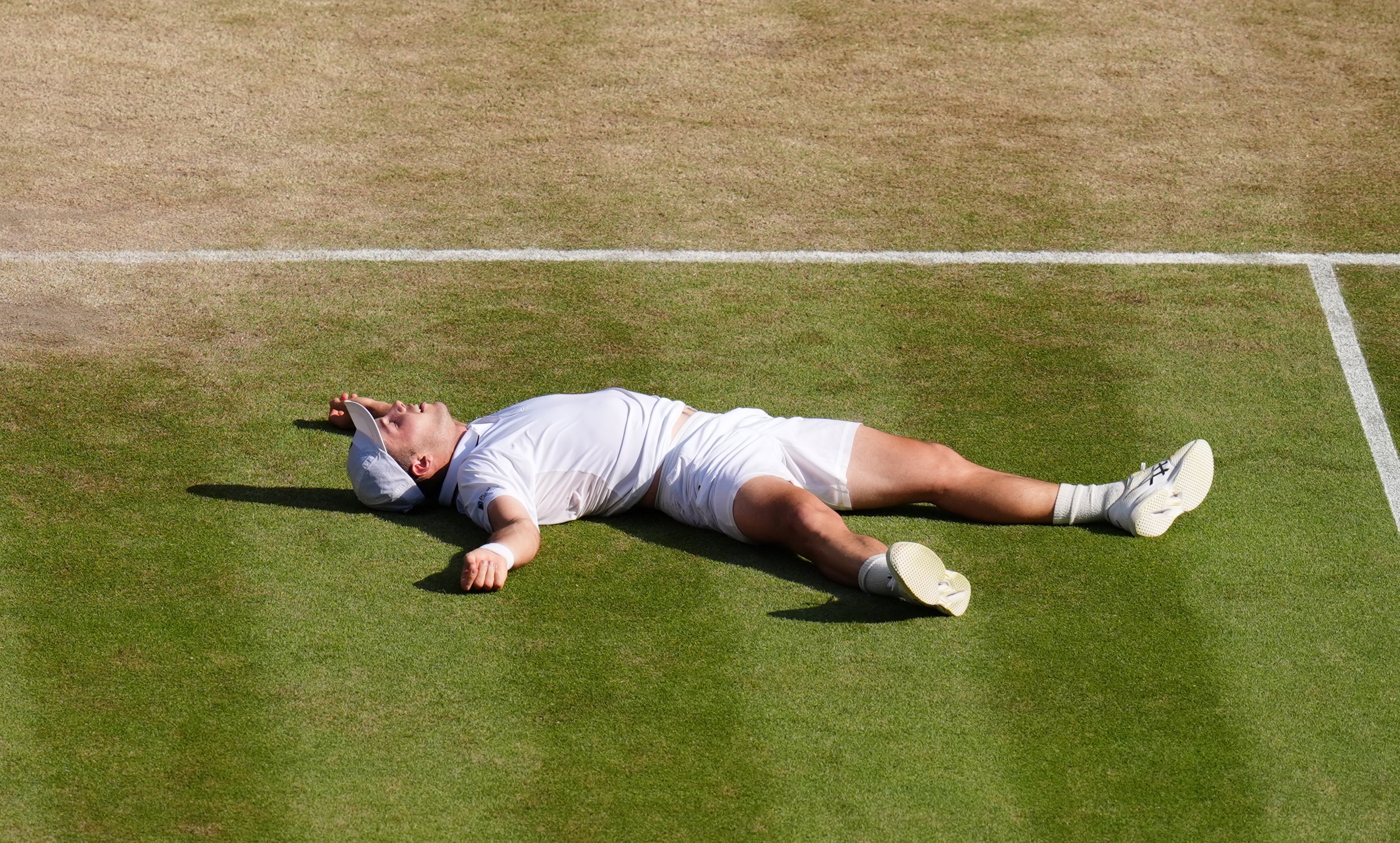 Arthur Fery lay on his back on Centre Court at Wimbledon following his win (John Walton/PA) (PA Wire)