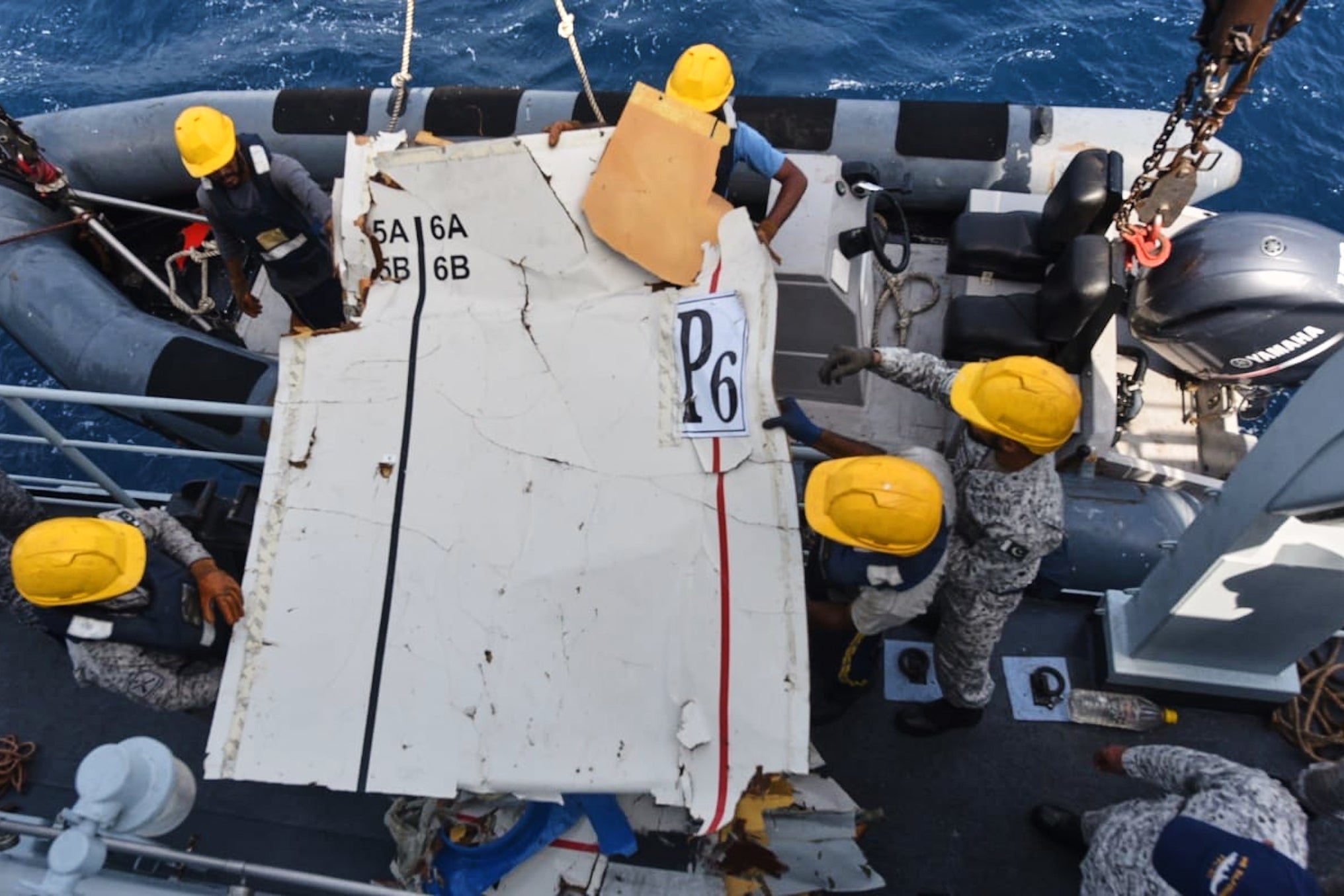 The navy and civilian teams in planes and ships found the plane debris after about 12 hours of searching