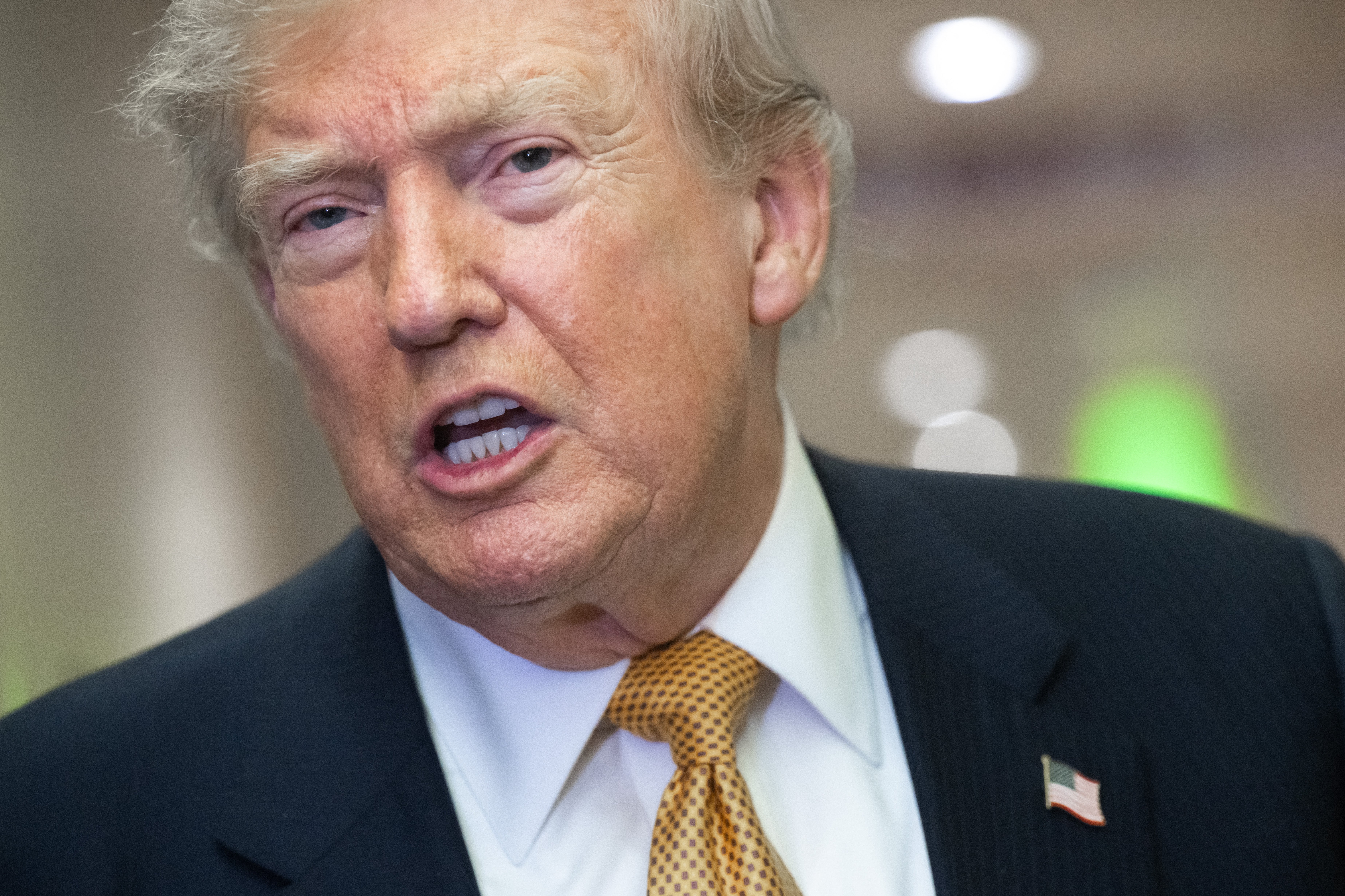 Donald Trump speaks to media aboard Air Force One