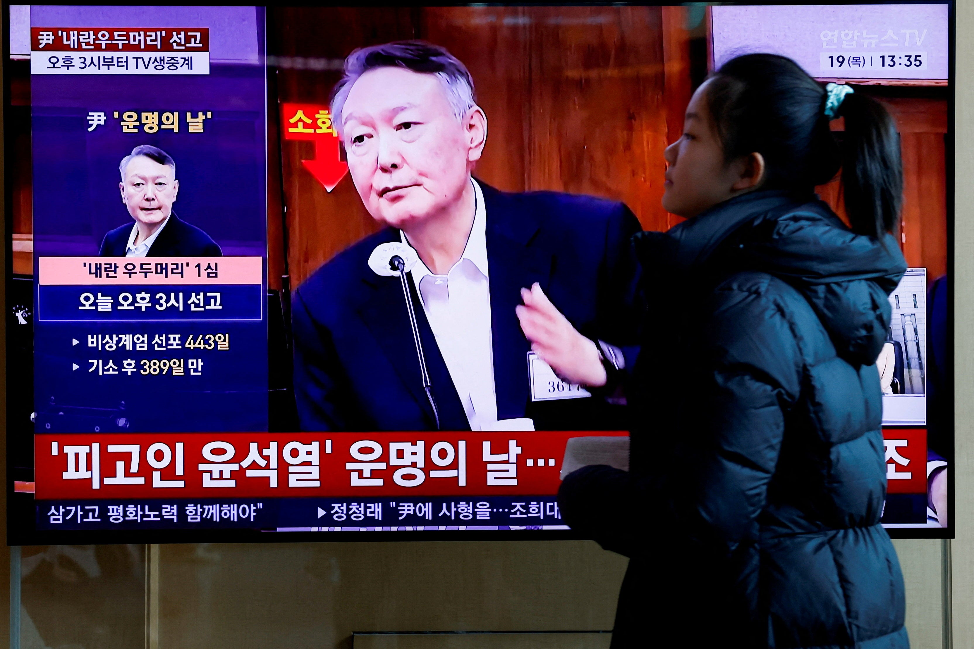 A TV screen showing a news report about the sentencing trial of South Korea’s former president Yoon Suk Yeol in the insurrection case (Reuters)