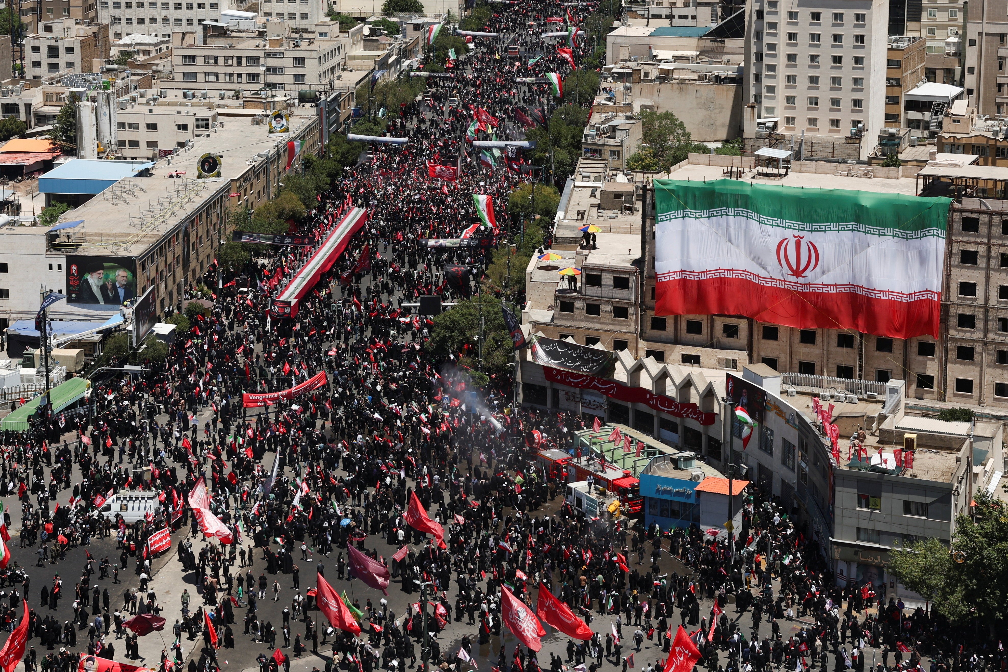 Mourners gather on the day of the burial of Iran's late Supreme Leader Ayatollah Ali Khamenei