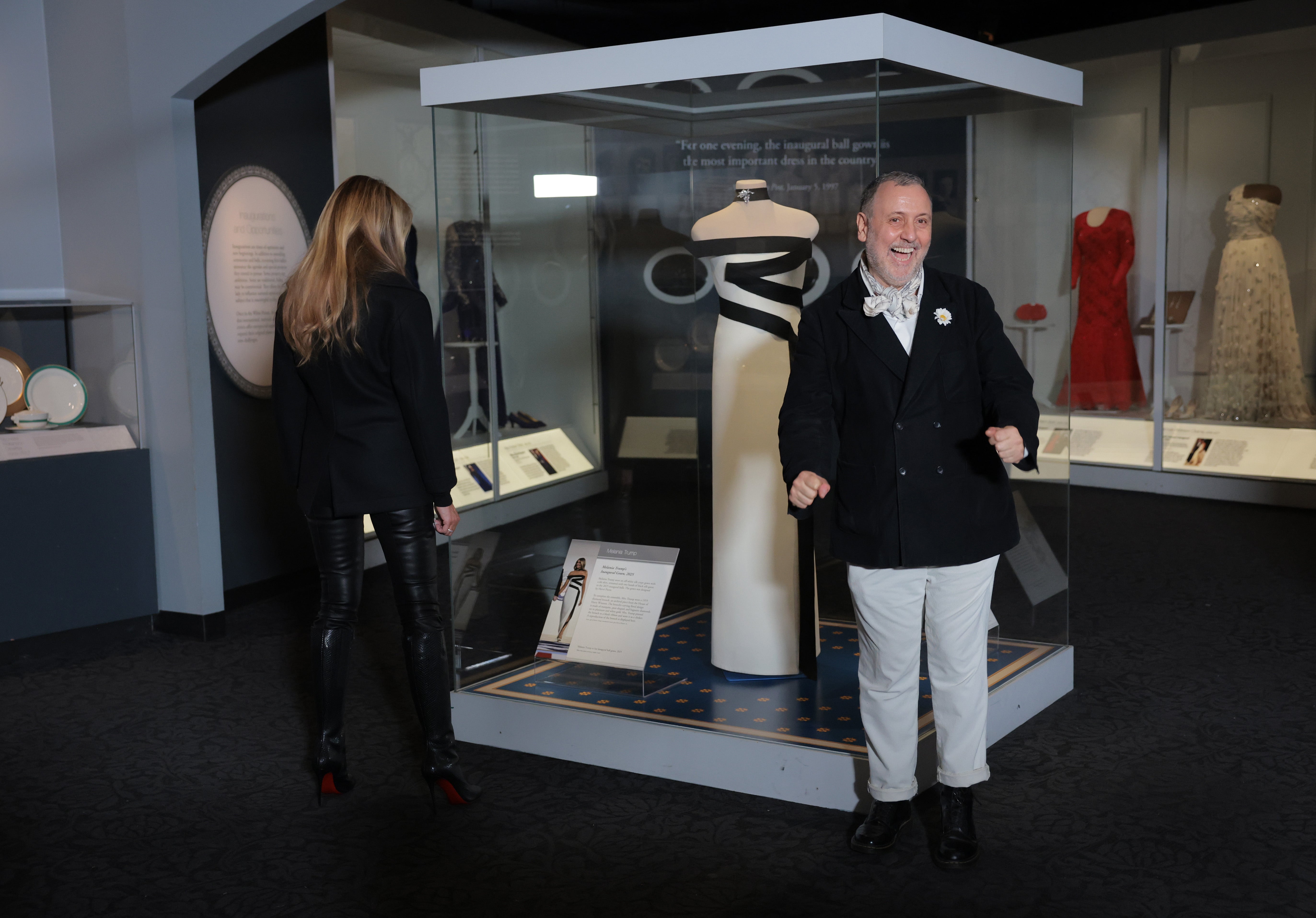 First lady Melania Trump and fashion designer Herve Pierre view her second inaugural dress during an event at the Smithsonian National Museum of American History on February 20, 2026