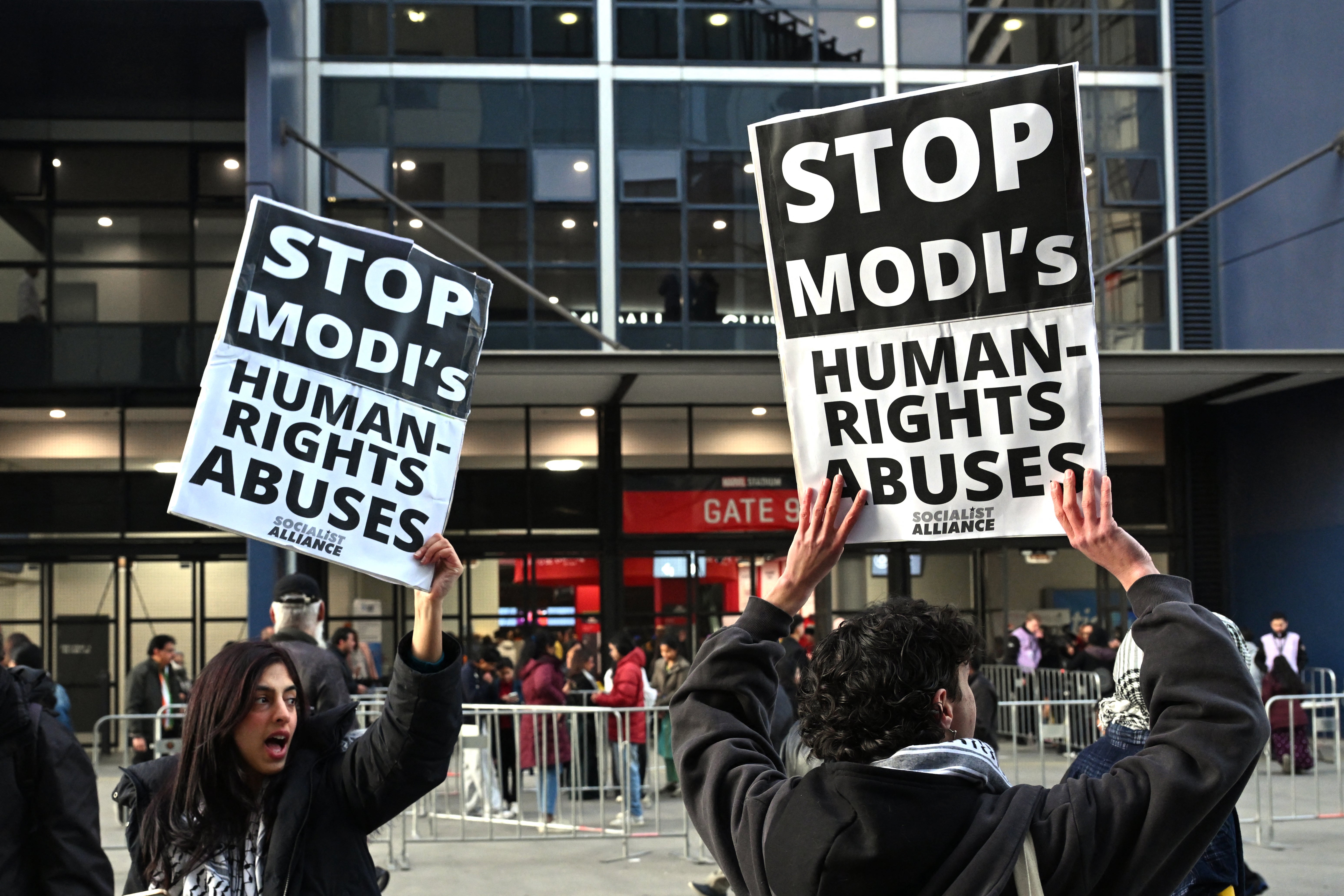 Narendra Modi’s critics shout slogans and hold placards outside a venue for a community event where the Indian prime minister is set to speak at Docklands Stadium in Melbourne on 9 July 2026