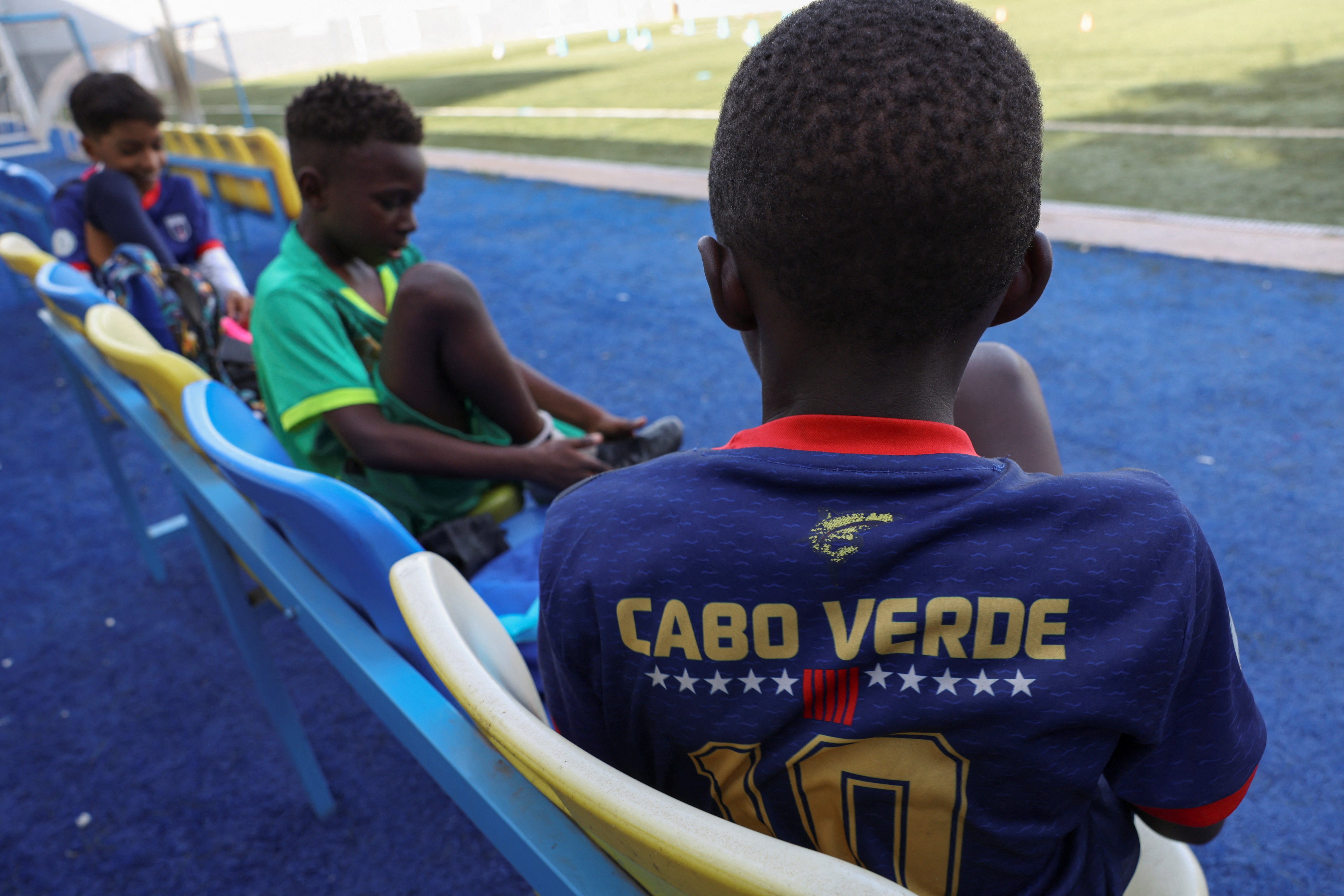 Youth trainees prepare ahead of a football training session in Bola Pra Frente football academy in Praia, Cape Verde