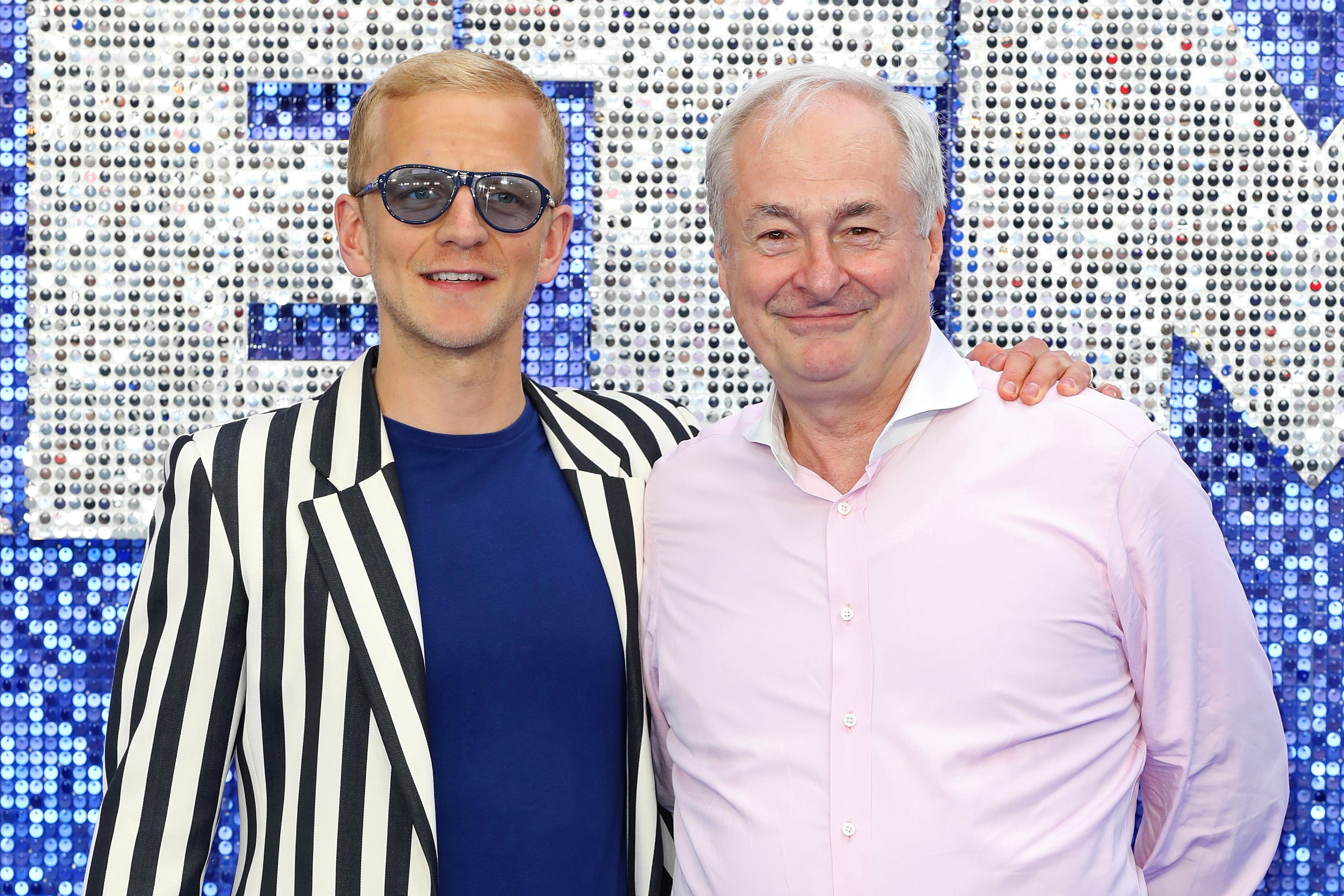 Paul Gambaccini with his husband Christopher Sherwood in 2019 (Getty)