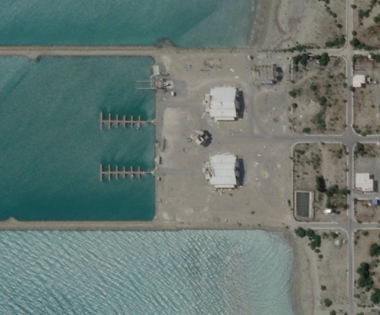 Satellite imagery shows an Iranian port building before the recent US strikes in Sarkhur Tahruyi (Reuters)