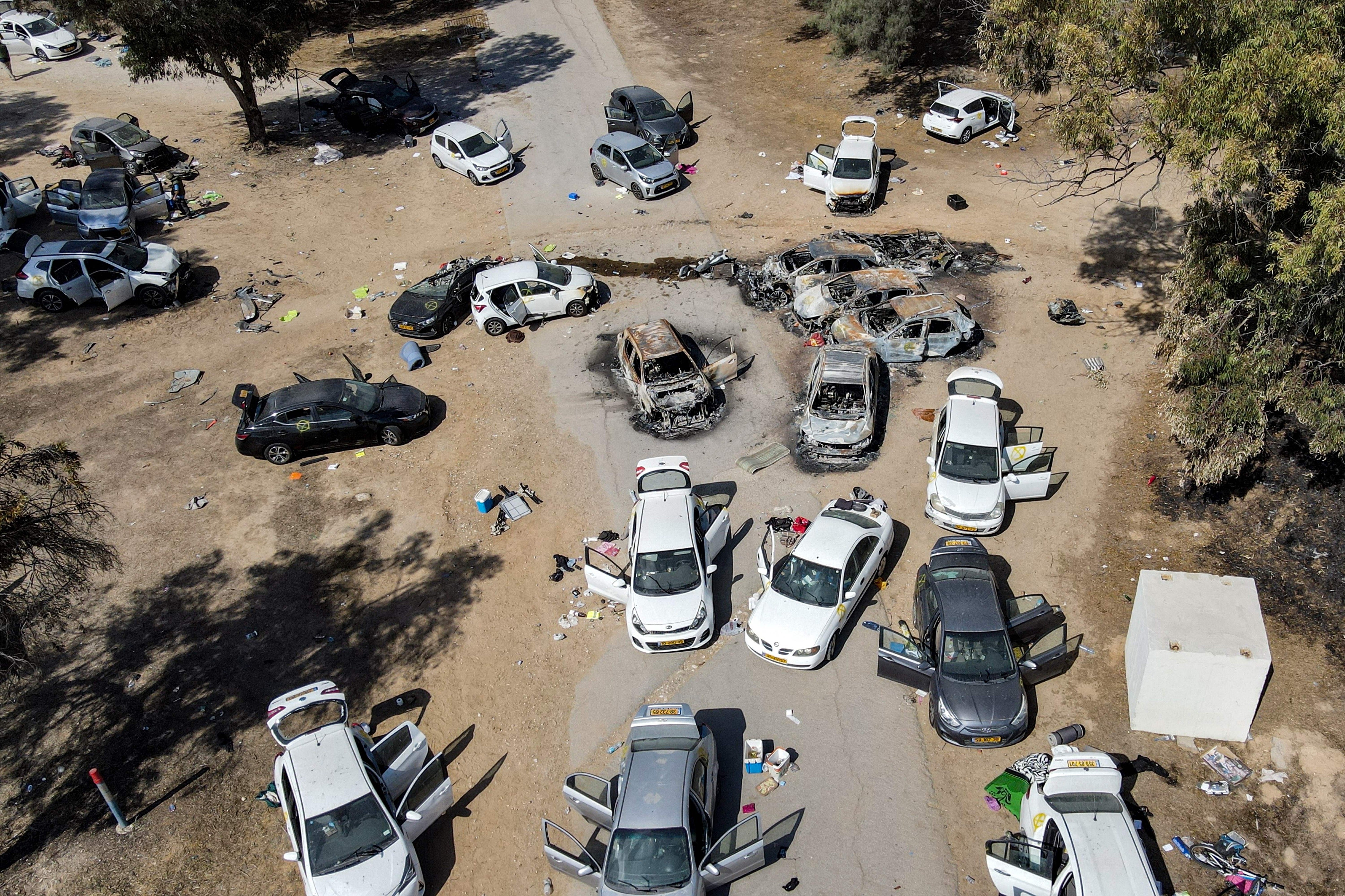 Abandoned vehicles at the site of the 7 October attack on the Nova music festival in the Negev desert in southern Israel.