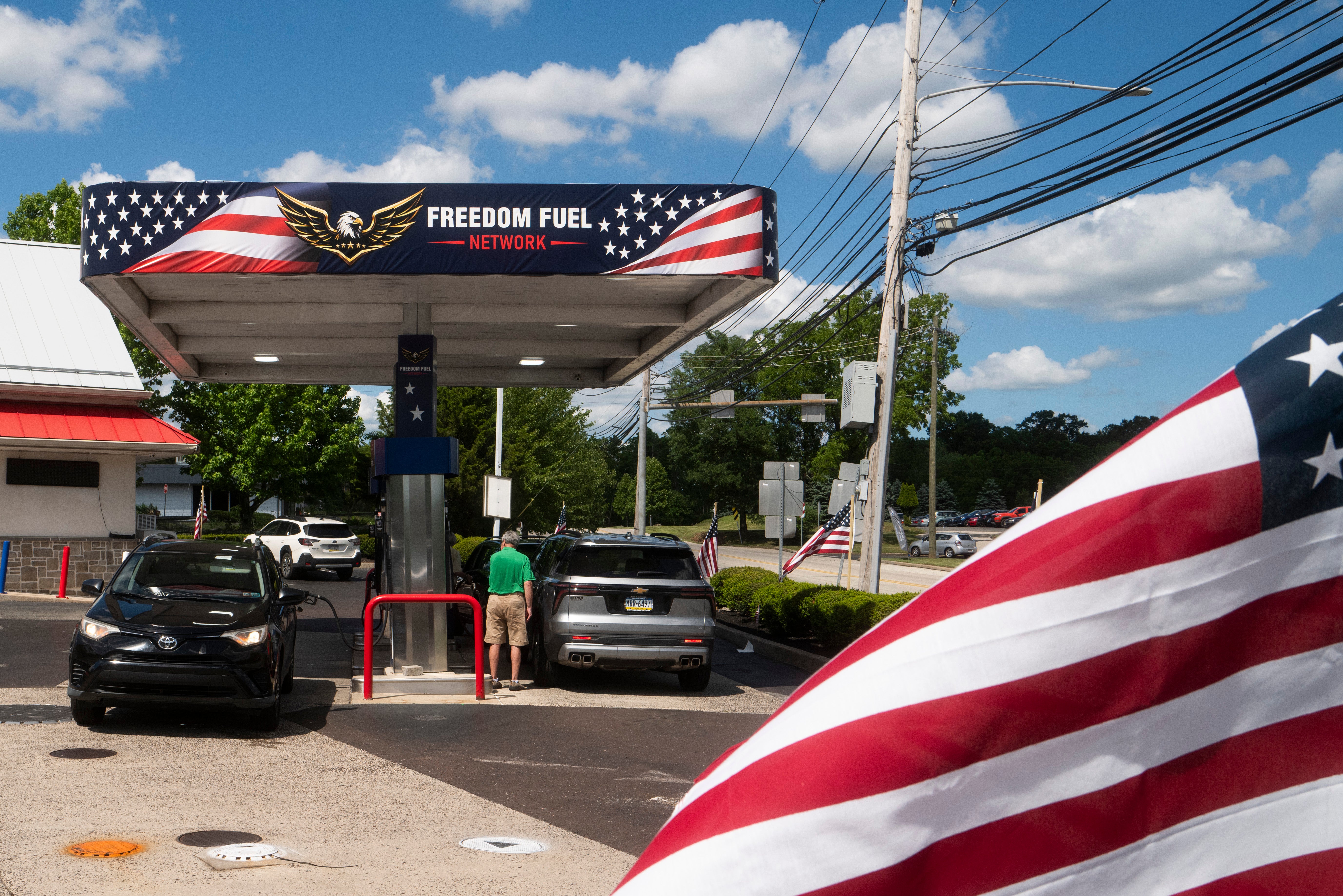 Customers pump gas at a Freedom Fuel Network station on July 8, 2026 in Dresher, Pennsylvania.