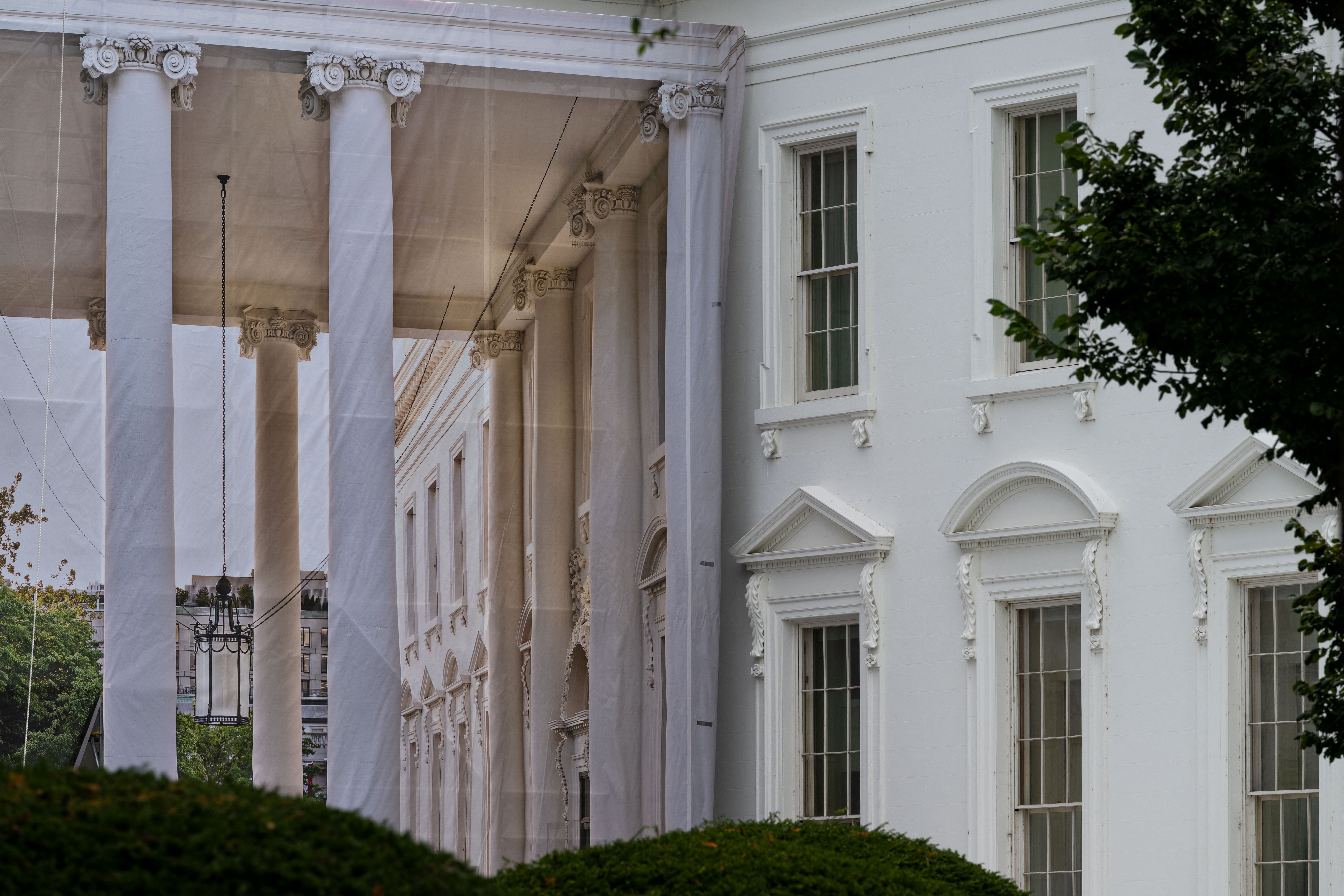 The protective covering shows the White House North Portico as if it was not covered by anything