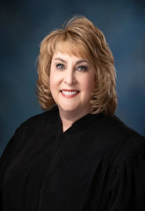 Judge Ellen M. Creel ultimately postponed the case until November