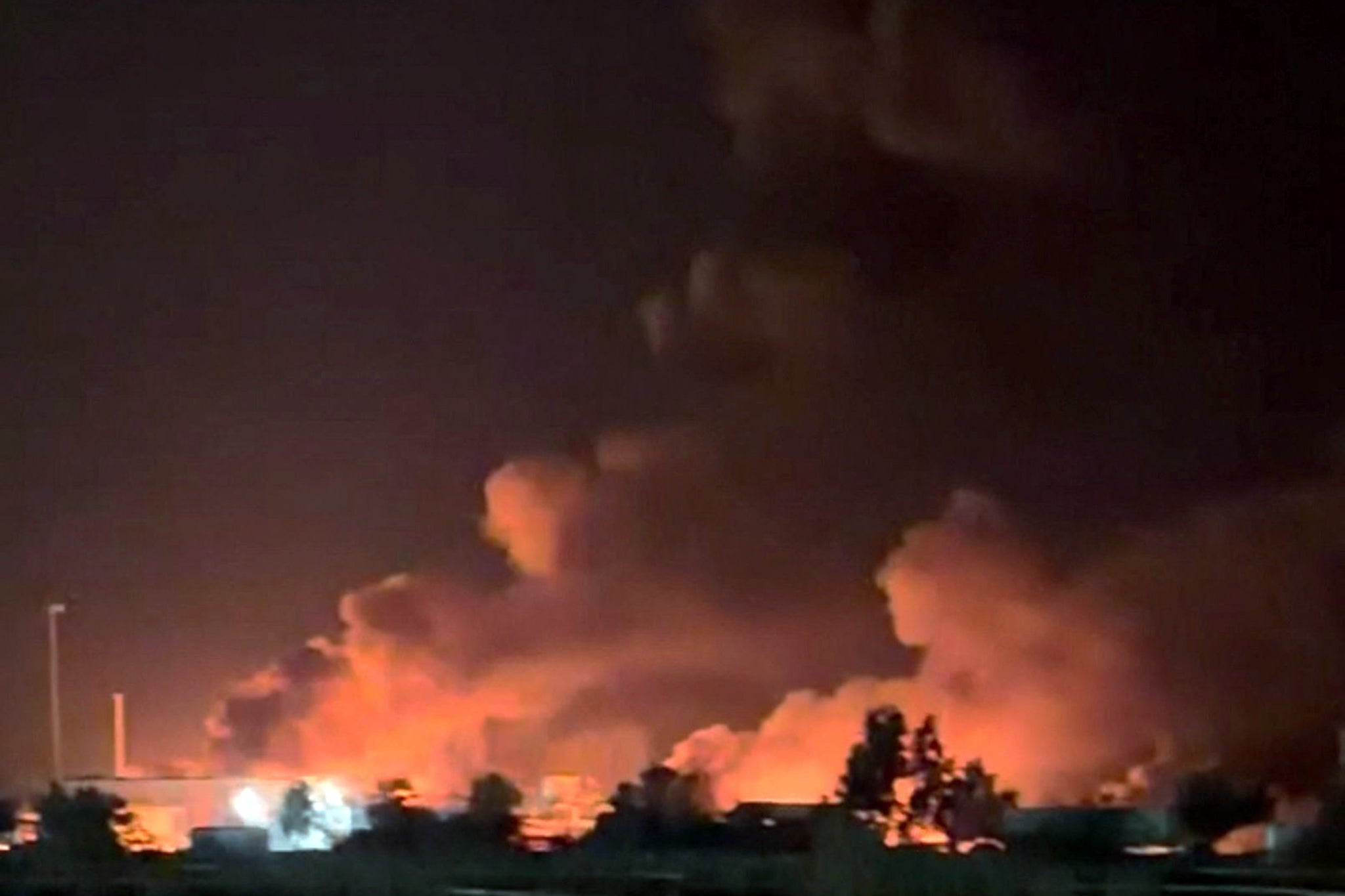 Smoke rises from a port, near Strait of Hormuz, following a U.S. strike in Kuhestak