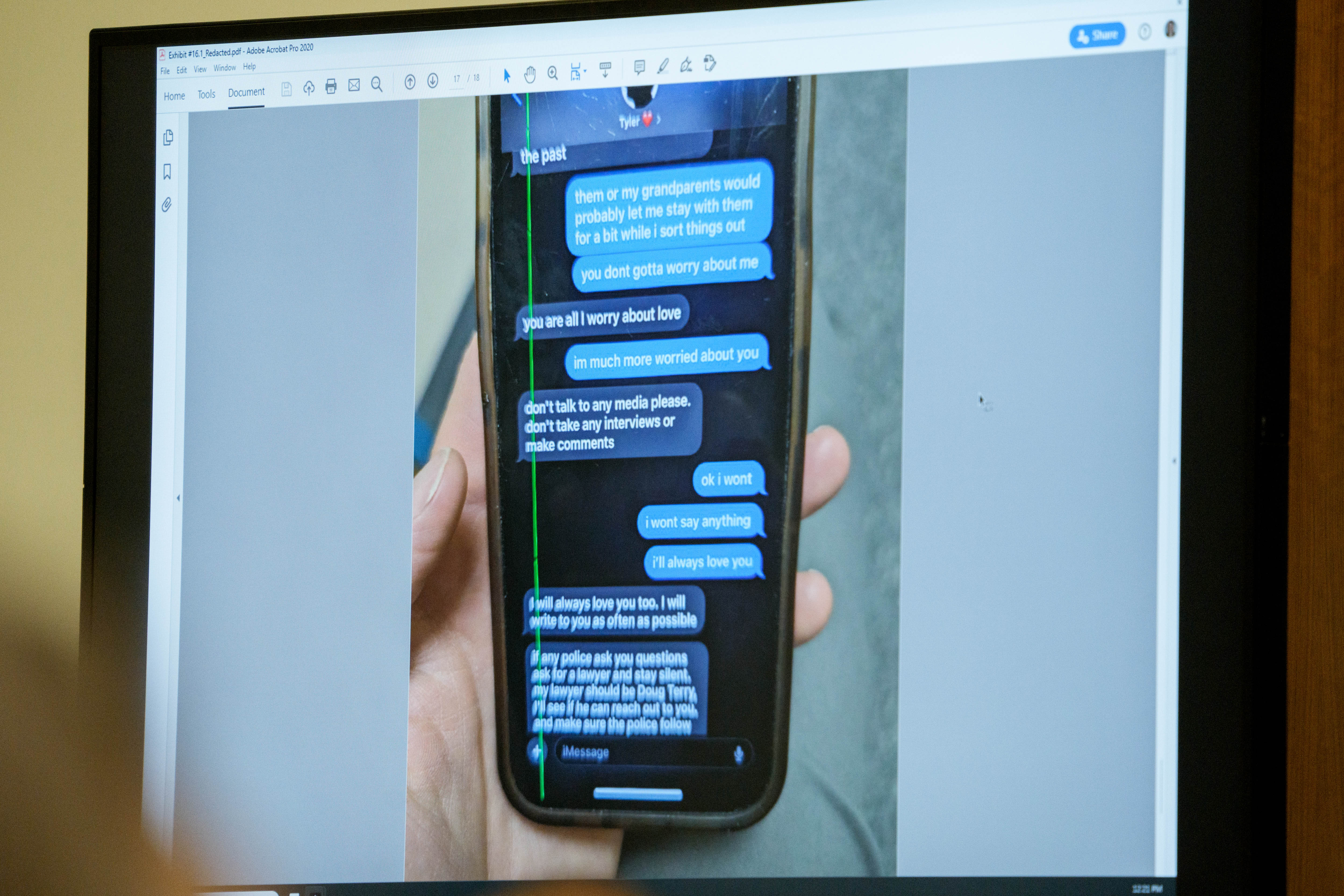 A photograph which prosecutors say shows a text message exchange between Tyler Robinson and Robinson's roommate and romantic partner Lance Twiggs