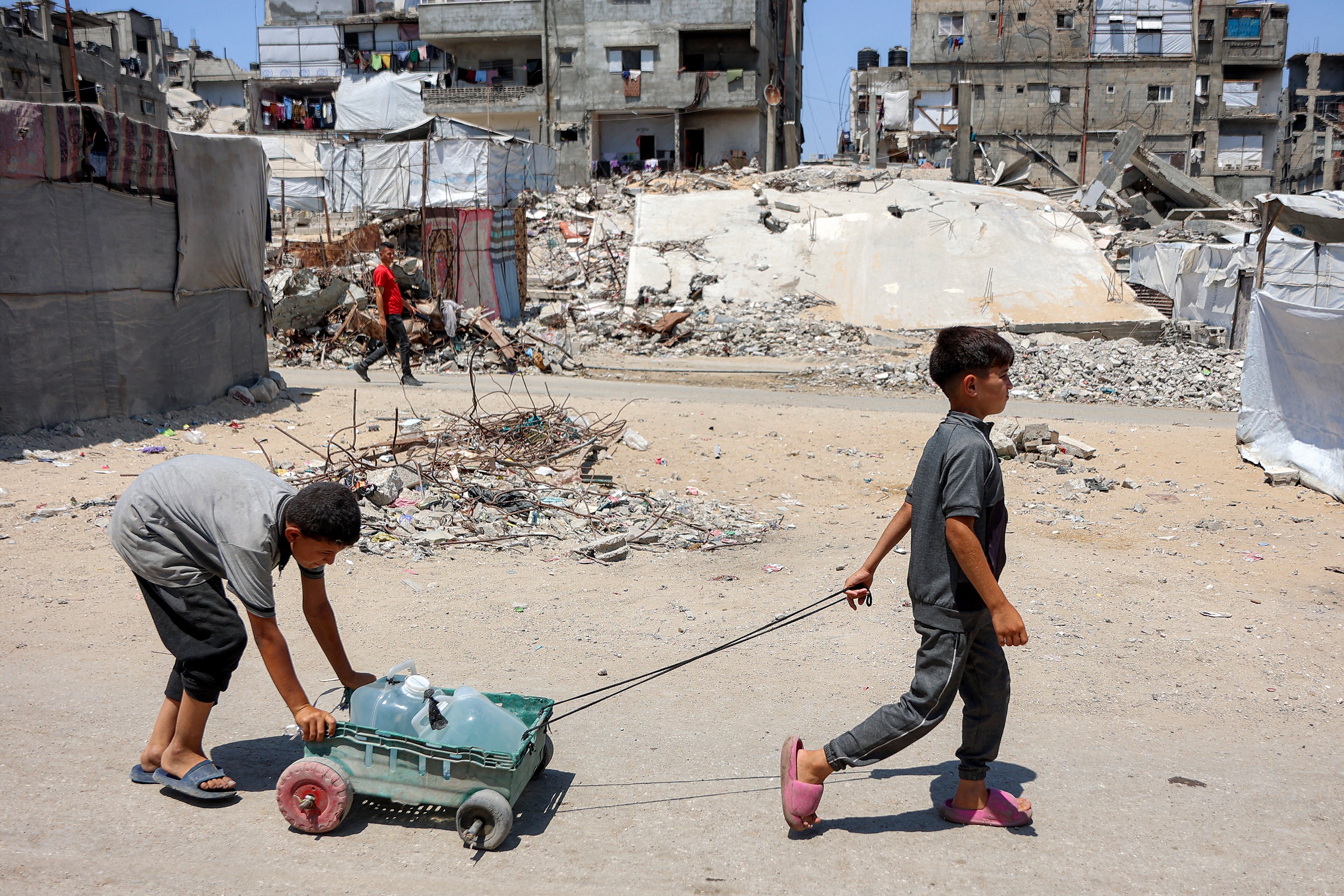 Children in Gaza are forced to transport water or goods to earn money to avoid starvation