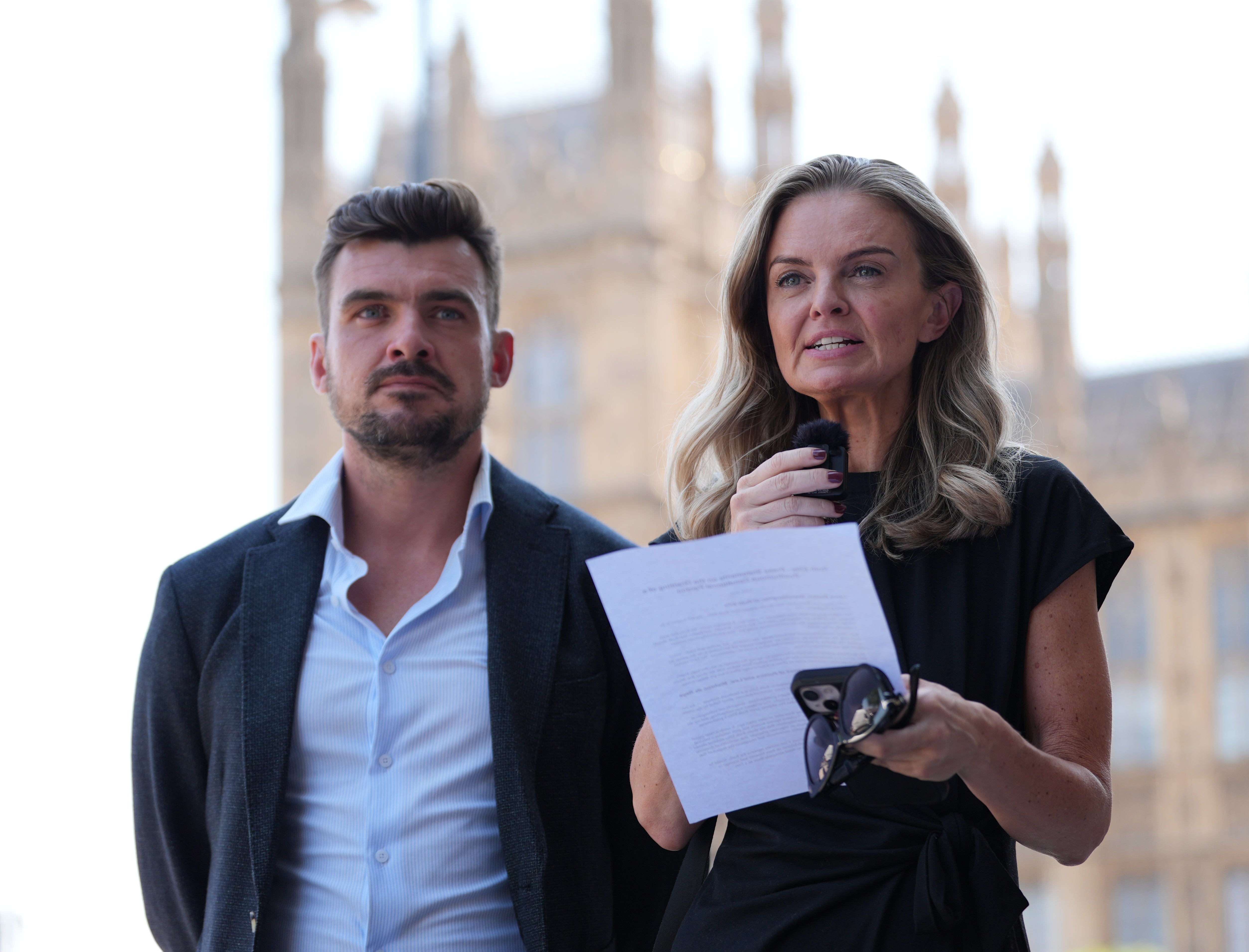 Ruth Ellis' grandchildren Laura Enston (centre) and Stephen Beard speak to the media outside Parliament House