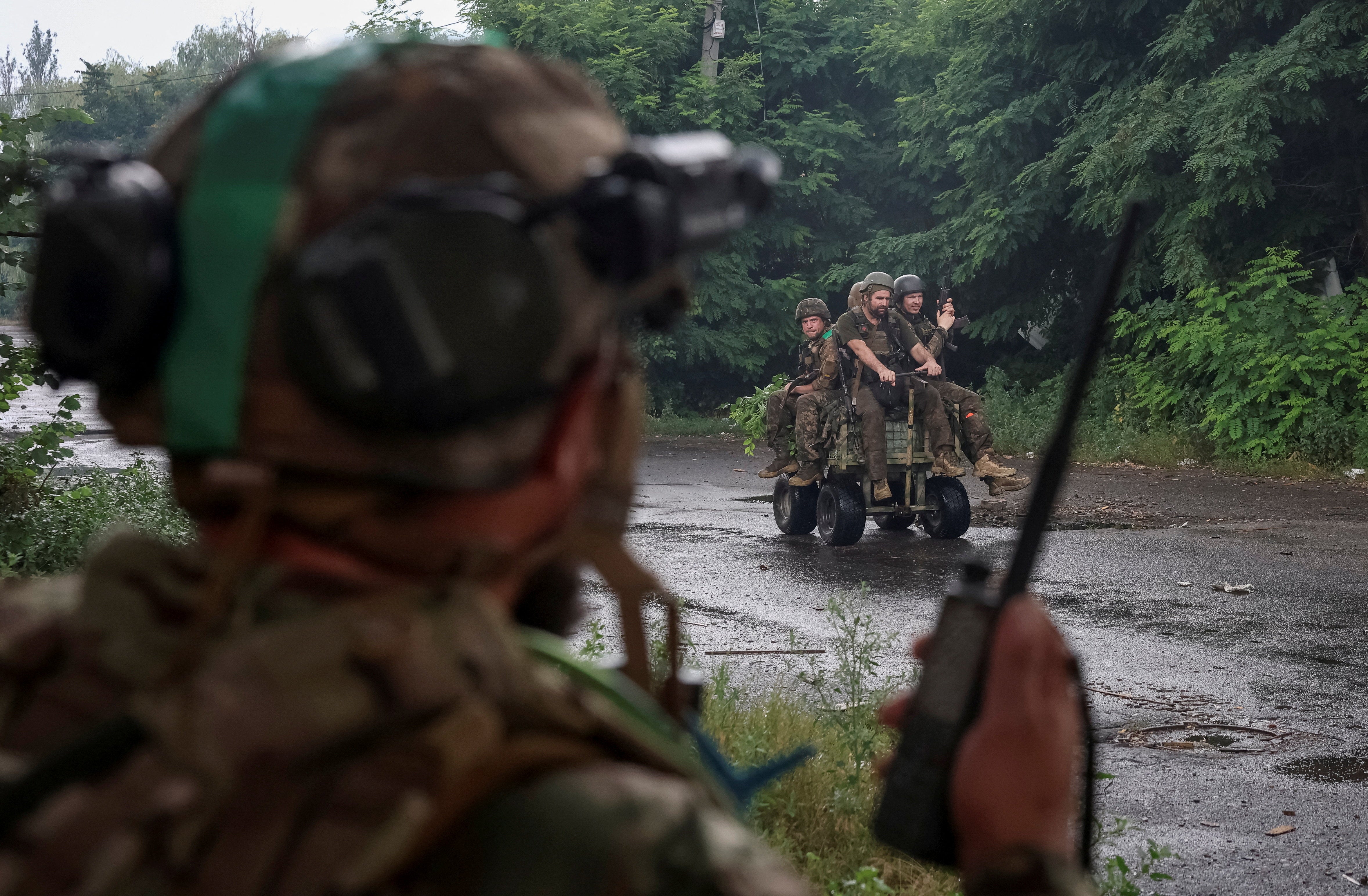 Ukrainian servicemen ride an unmanned ground vehicle (UGV) during their combat mission, amid Russia's attack on Ukraine, in the frontline town of Druzhkivka, in Donetsk region, Ukraine July 9, 2026.