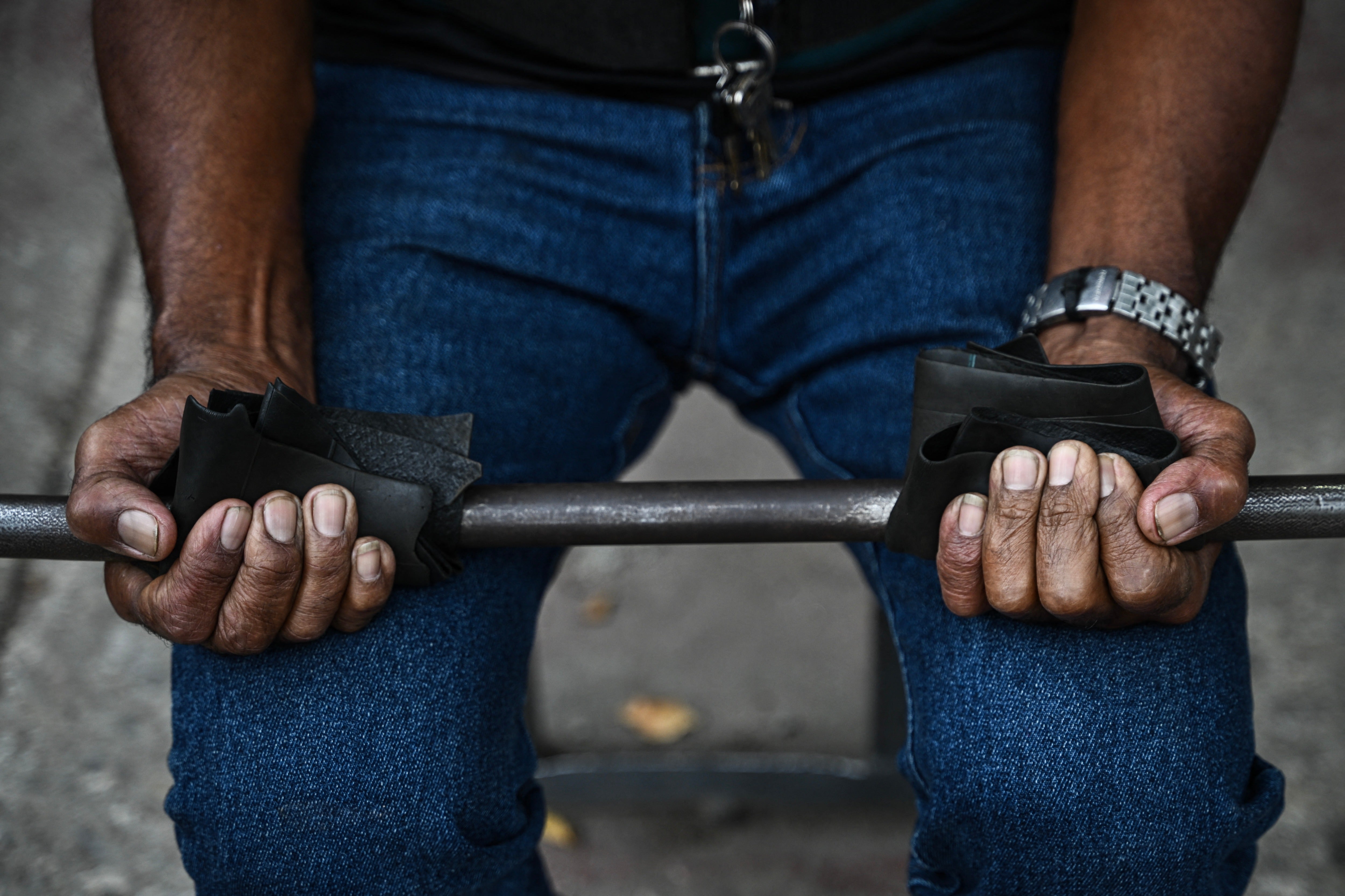 A man exercises at La Candelaria square, an outdoor public gym