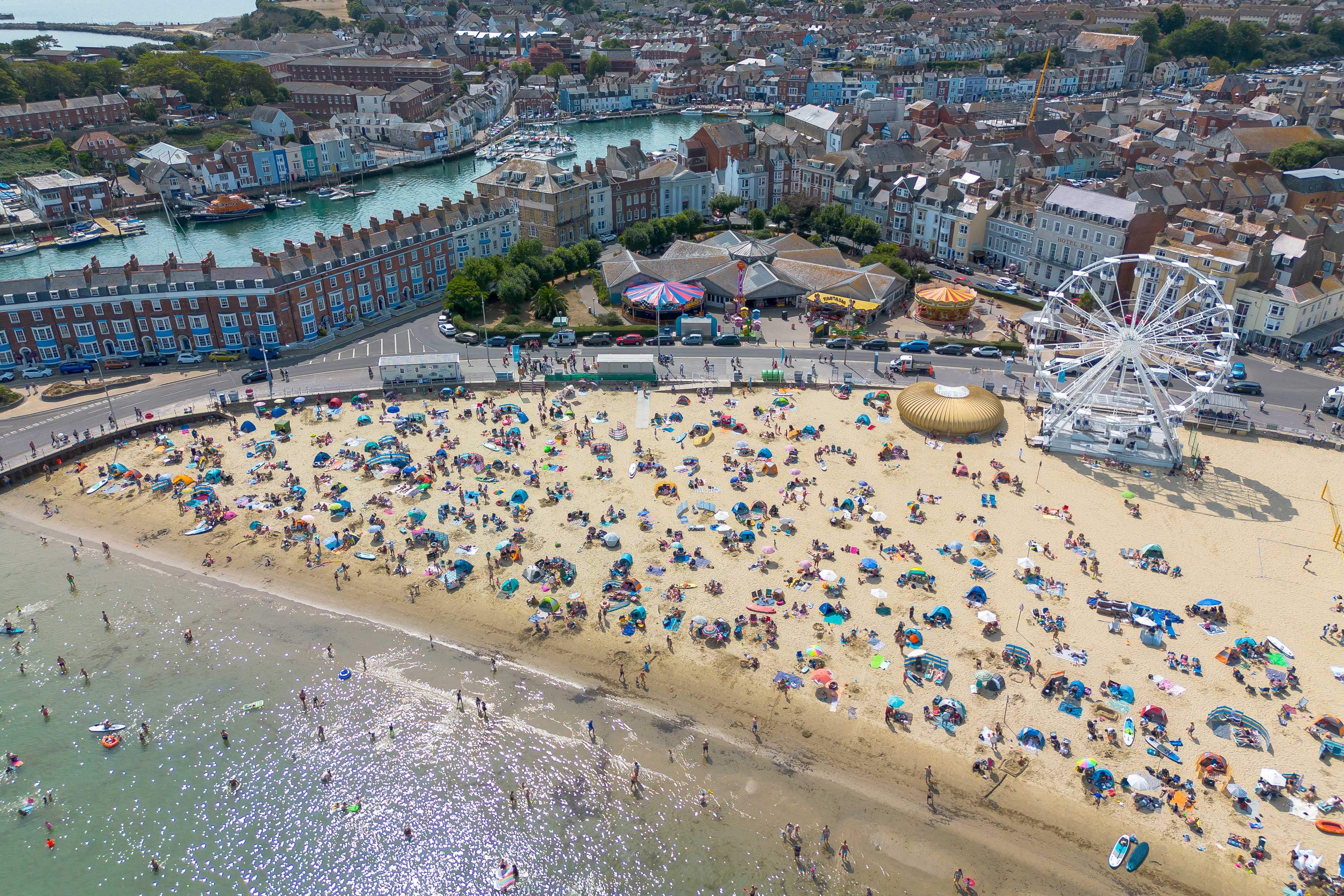 Weymouth Harbour, seen above left, is near Weymouth beach