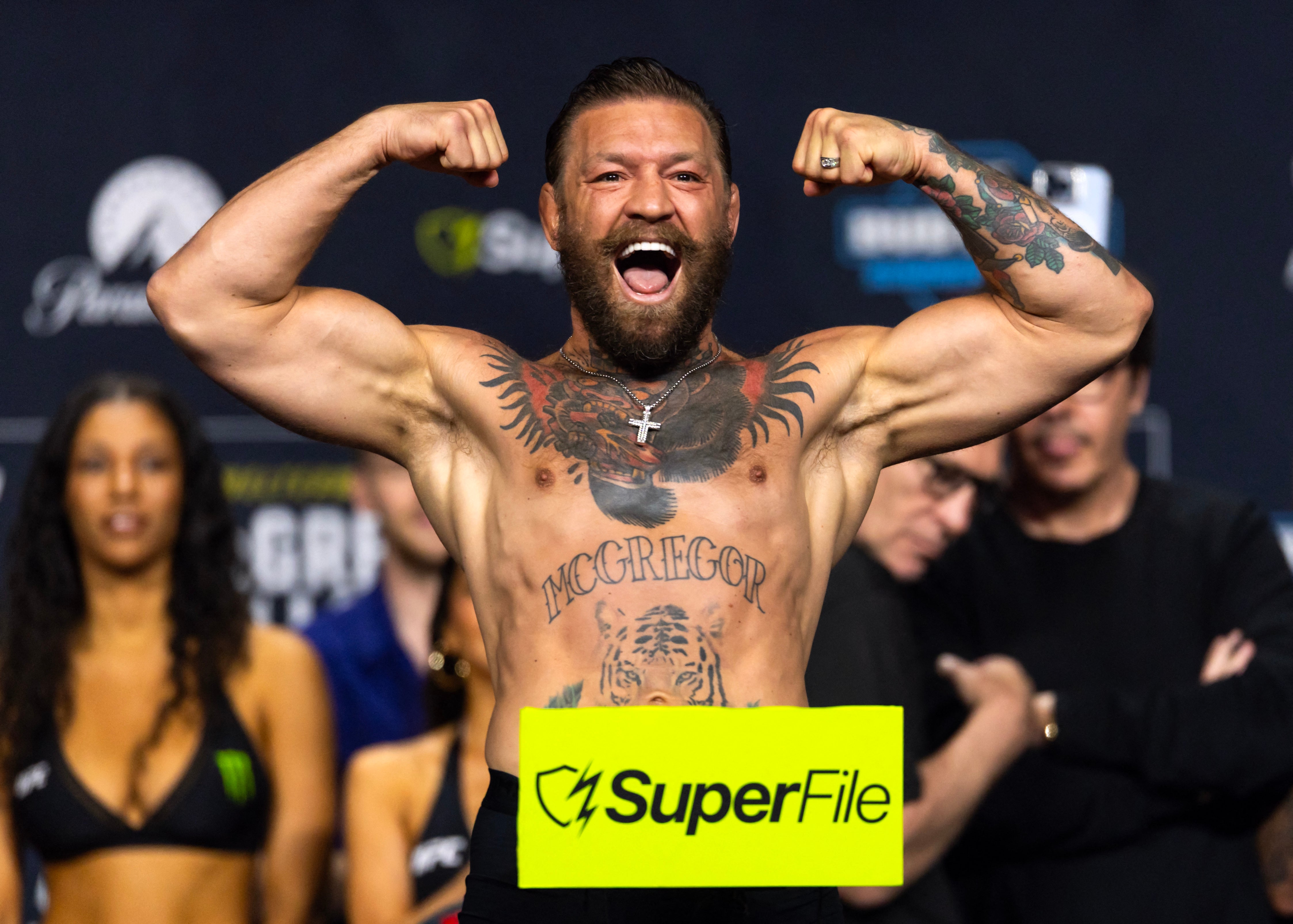 McGregor vs Holloway LIVE: &lsquo;Notorious&rsquo; slaps rival after making weight for controversial UFC 329 fight