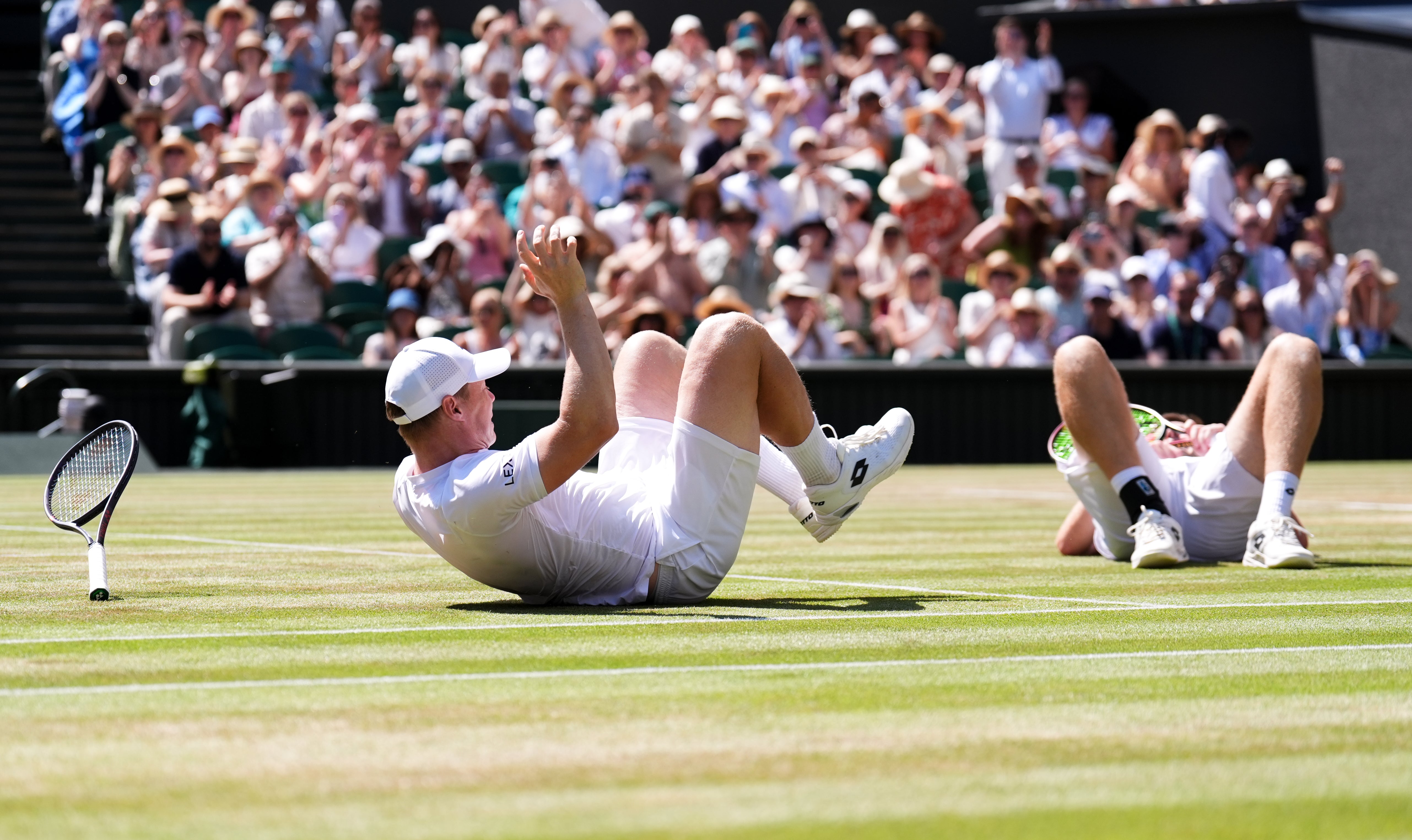 The pair both dropped to the ground in joy after sealing the title (PA)