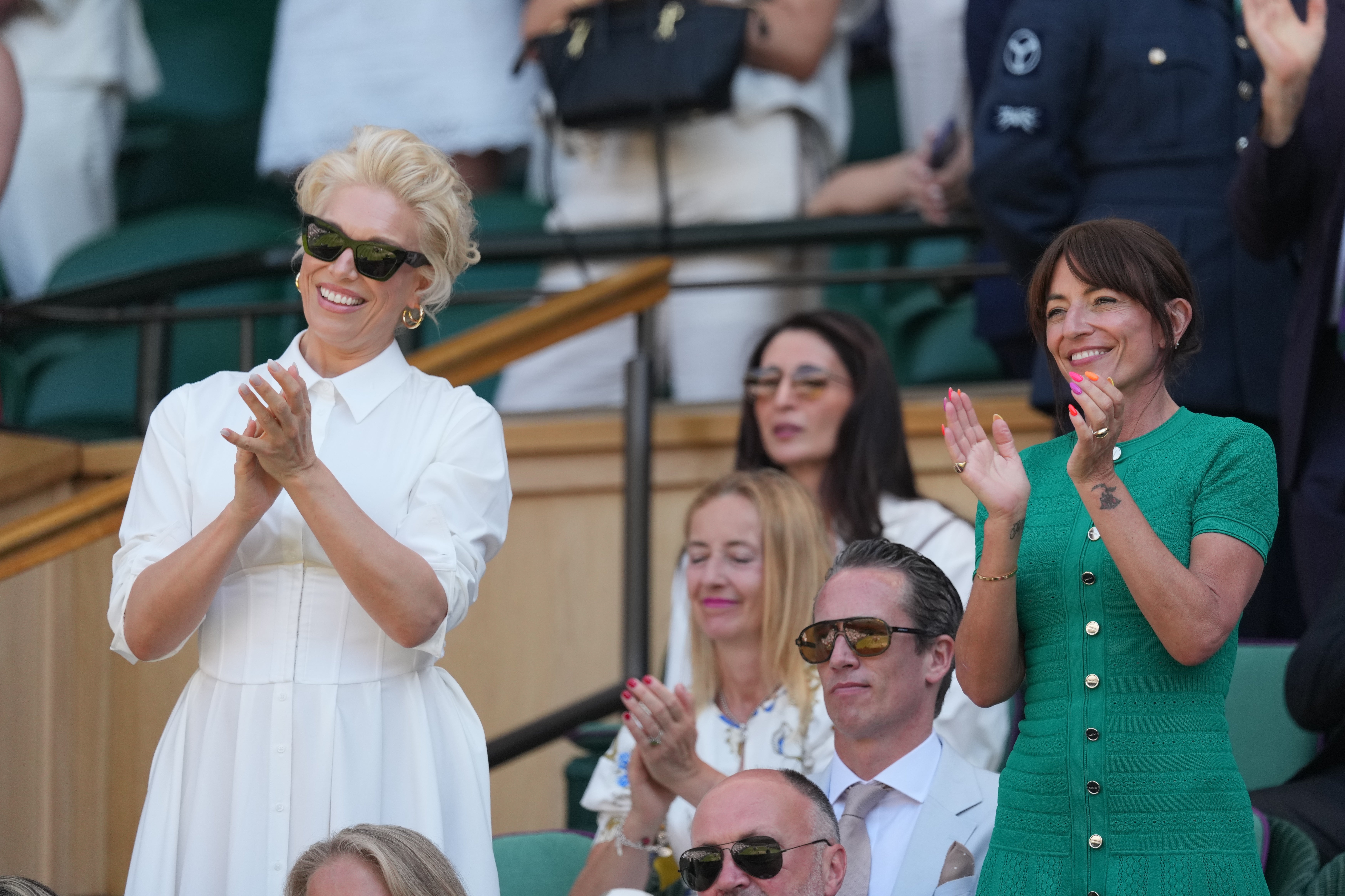 Hannah Waddingham and Davina McCall applauding the winners of the men's doubles final (AP)