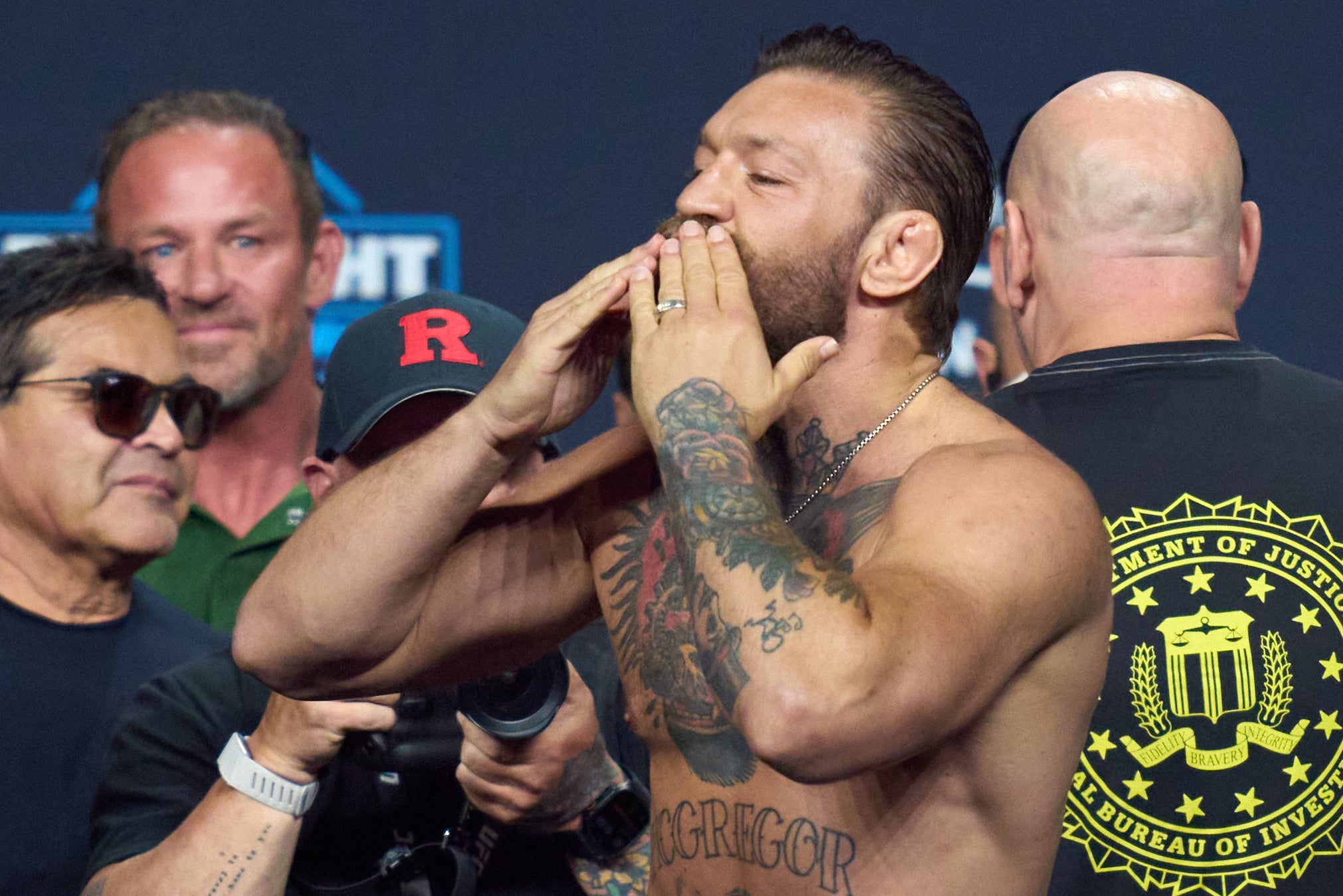 Conor McGregor reacts during a ceremonial weigh-in for UFC 329