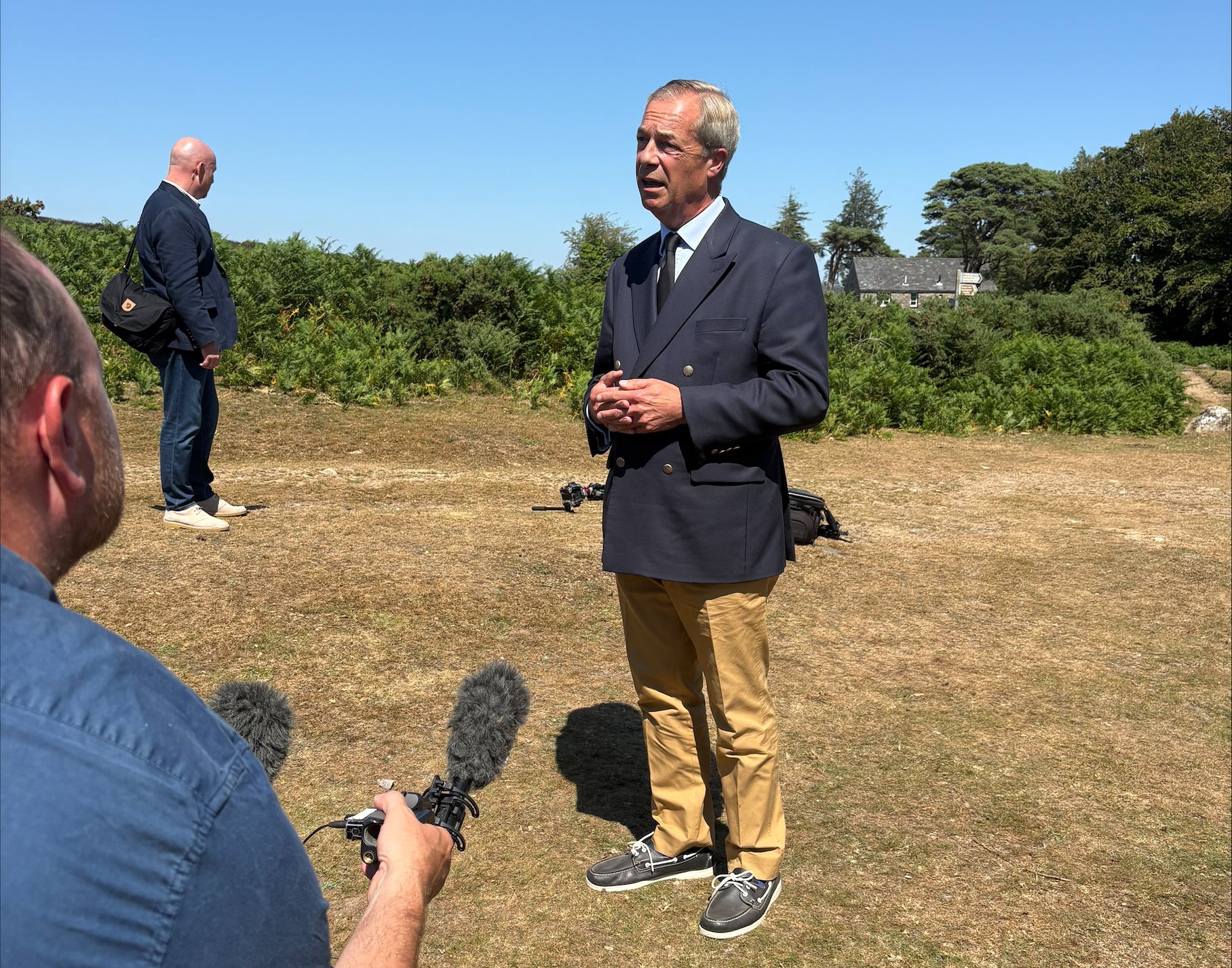 Reform UK leader Nigel Farage speaking to the media after he laid a wreath near to the home of Ann Widdecombe in Haytor in Dartmoor