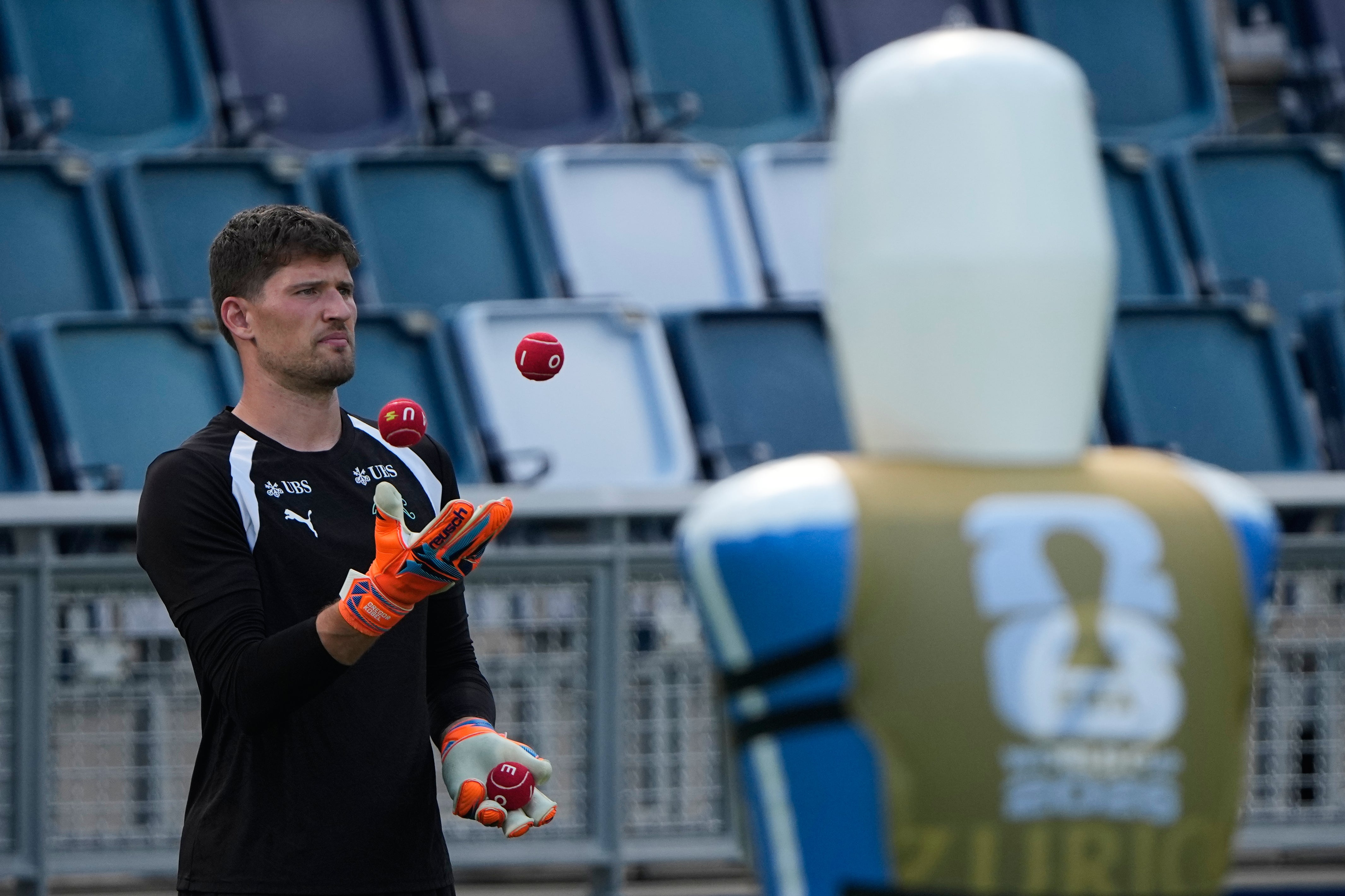 Switzerland goalkeeper Gregor Kobel juggles during training