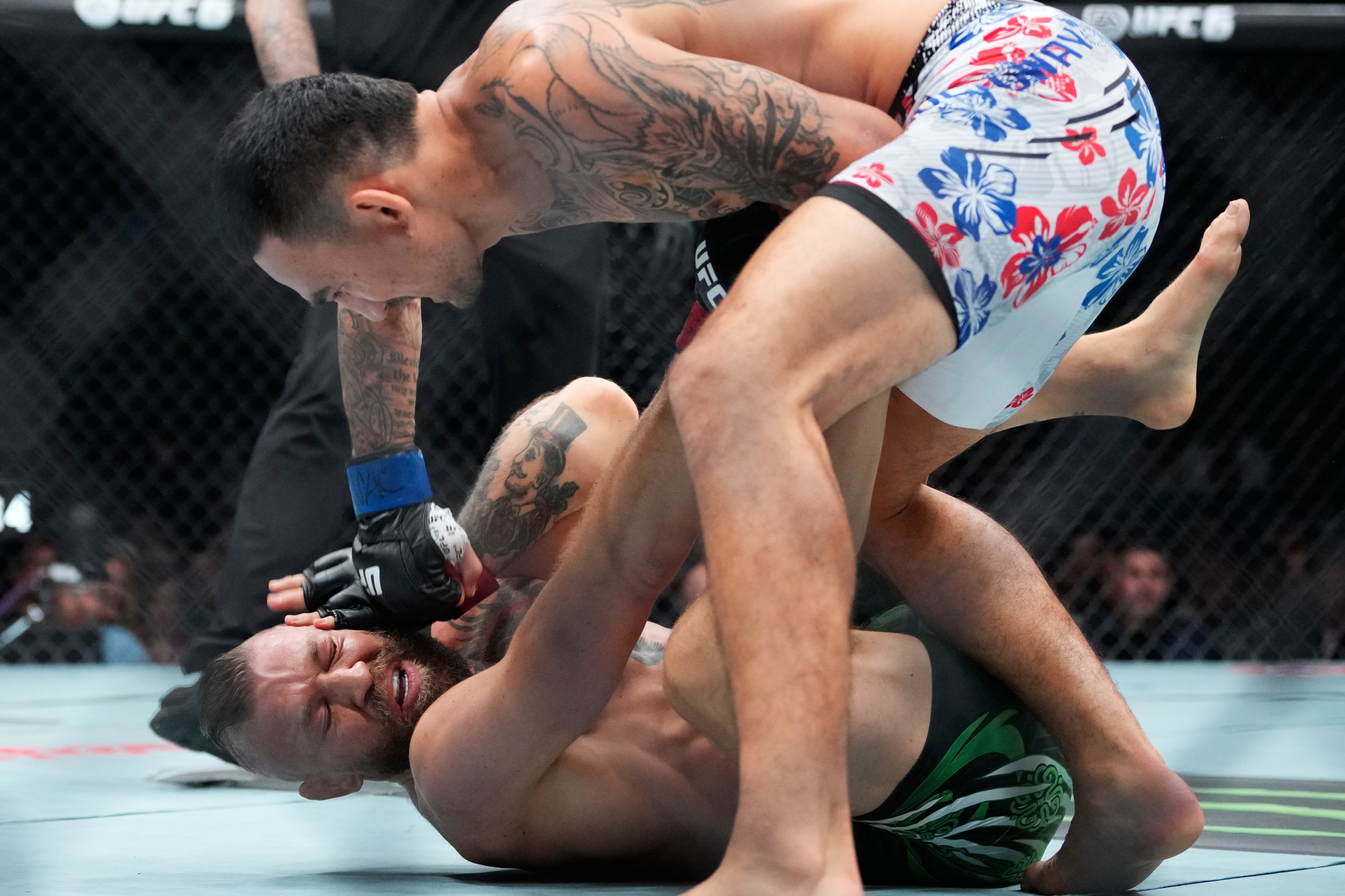 McGregor slipped to the canvas twice before calling off the fight (AP)