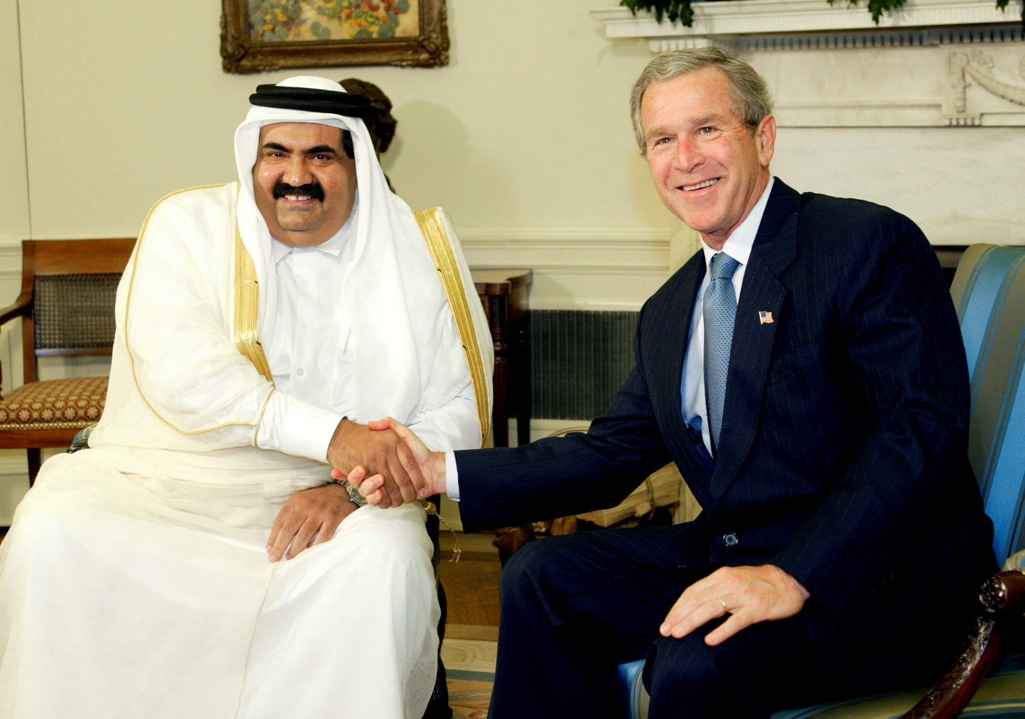 US president George W Bush with Sheikh Hamad bin Khalifa al-Thani of Qatar in the Oval Office of the White House, Washington DC, on 8 May 2003