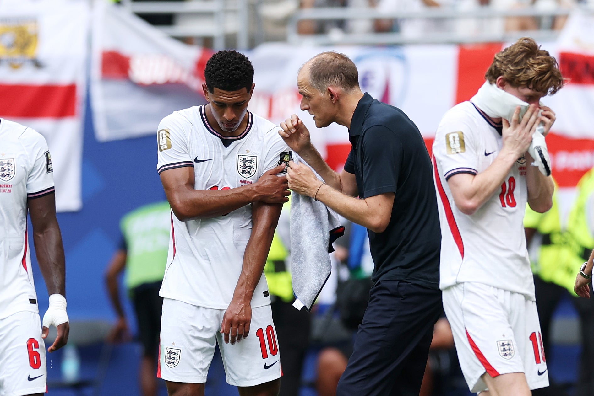 Bellingham takes instructions from his manager during the game