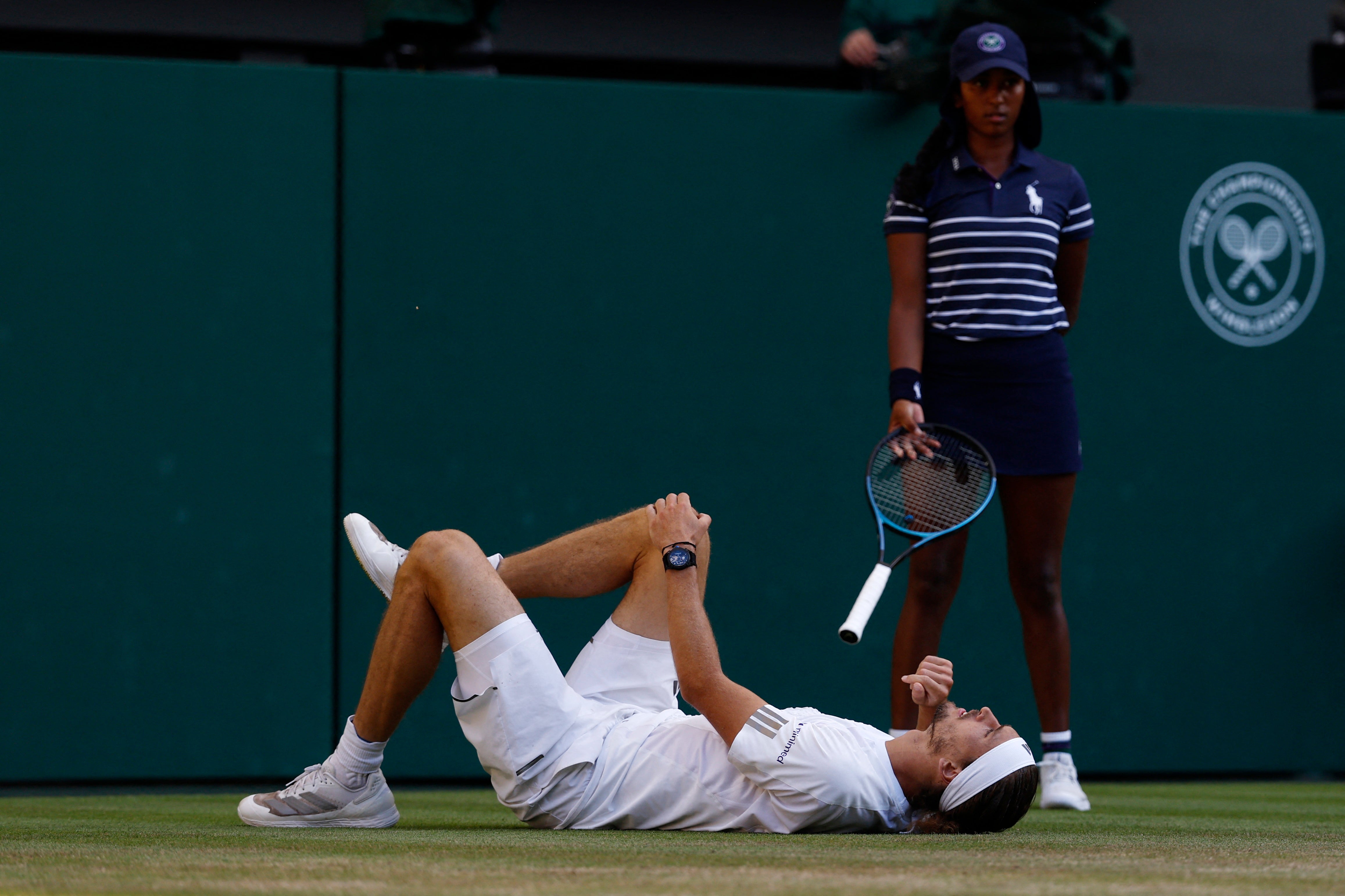 Zverev fell as he slipped behind the baseline trying to chase down Sinner’s drop shop