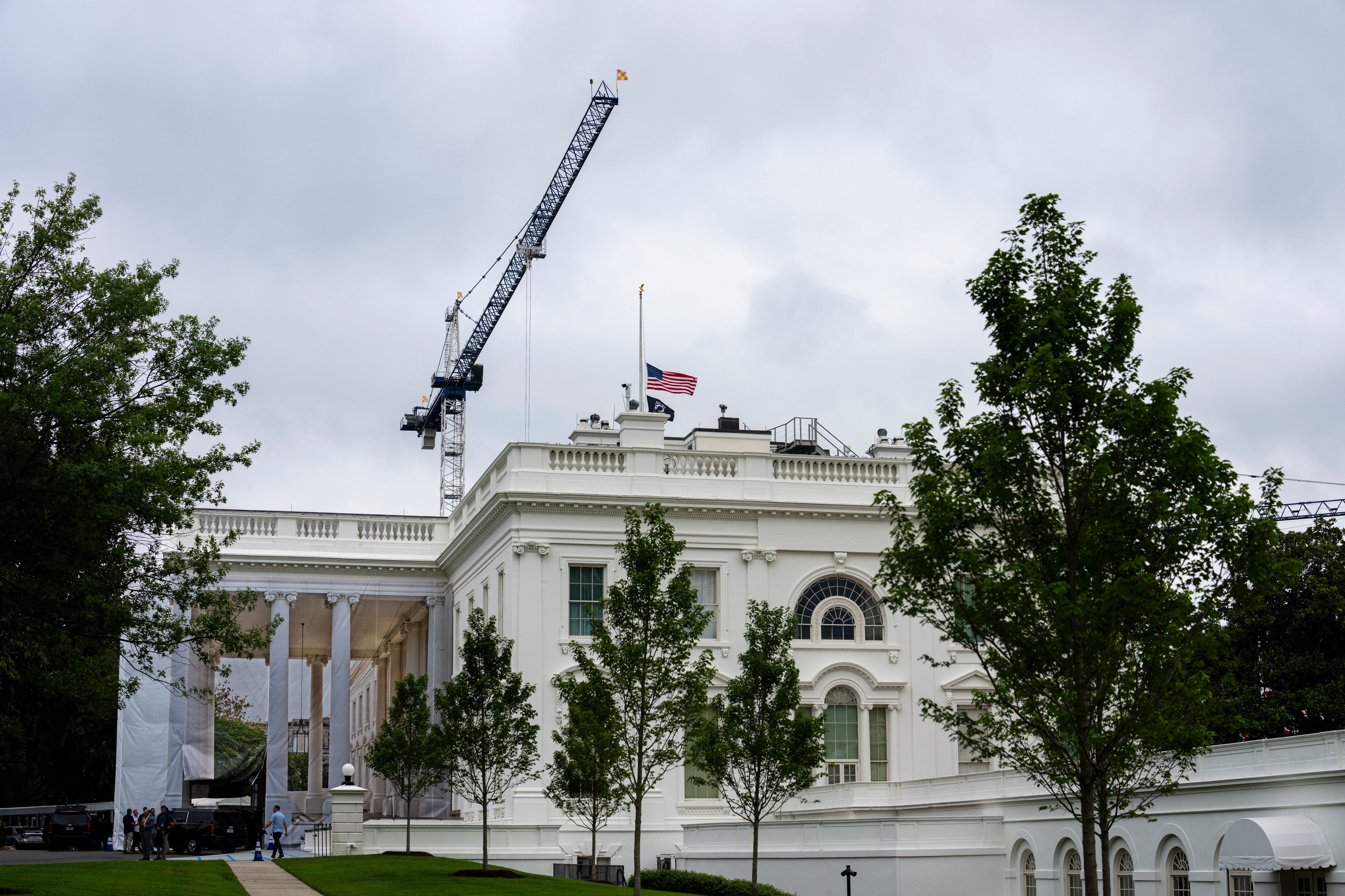 The American flag flies at half-staff above the White House on Sunday, following the death of Sen. Lindsey Graham