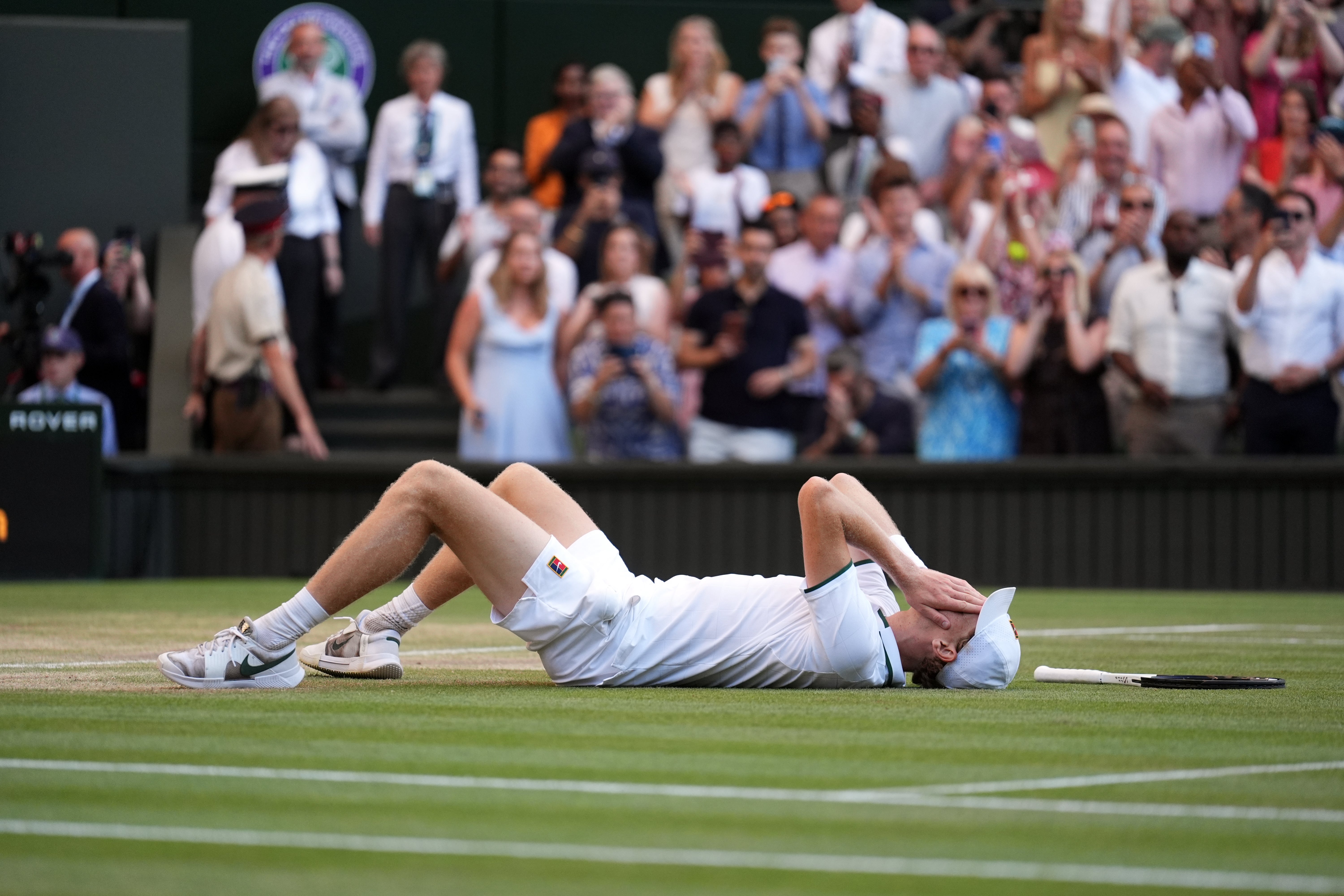 Jannik Sinner lies on his back after beating Alexander Zverev (Mike Egerton/PA)