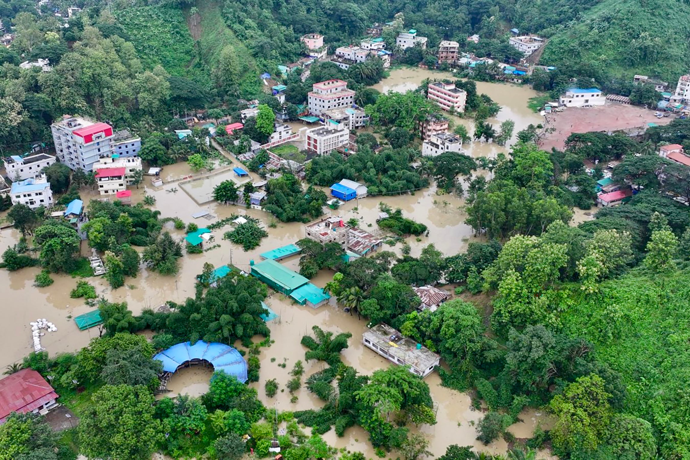 This aerial photograph shows partially submerged residential buildings following heavy rains in Bangladesh's Bandarban town (AFP/Getty)