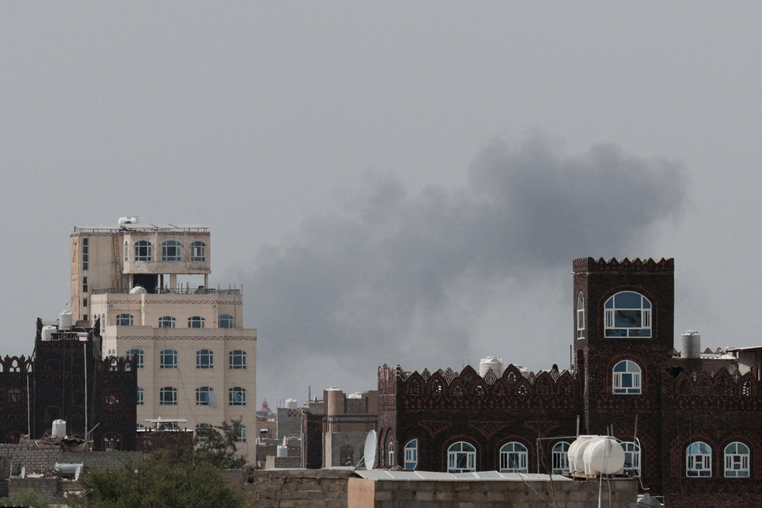 Smoke rises following an airstrike after Yemen's defense ministry said that its armed forces had targeted the runway at Sanaa International Airport, in Sanaa, Yemen (Reuters)