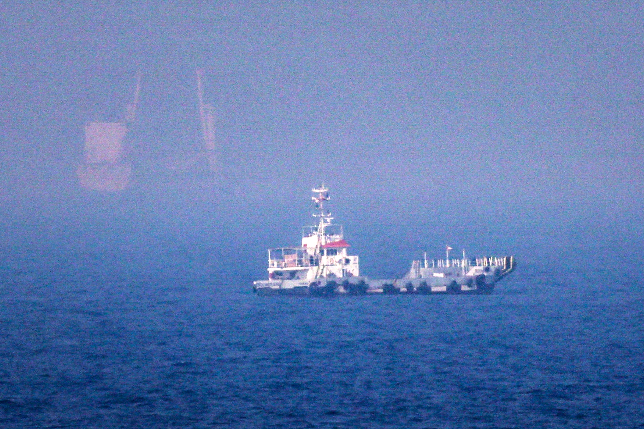 This picture shows ships sailing near the Strait of Hormuz off the eastern coast of the United Arab Emirates at Khor Fakkan on 13 July