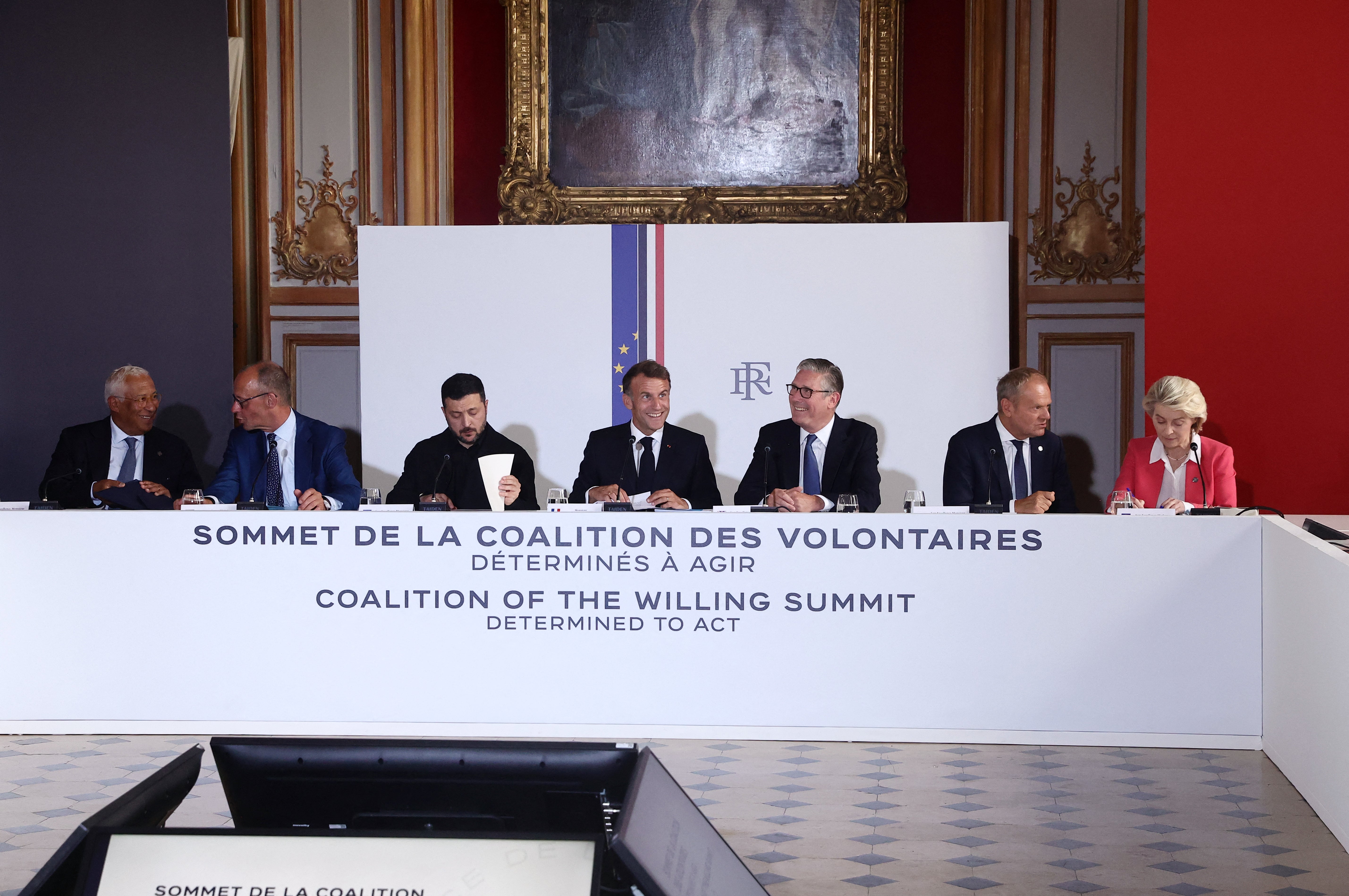 (LtoR) European Council President Antonio Costa, German Chancellor Friedrich Merz, Ukrainian President Volodymyr Zelensky, French President Emmanuel Macron, British Prime Minister Keir Starmer, Polish Prime Minister Donald Tusk, and European Commission President Ursula von der Leyen attend take part in a summit of the Coalition of the Willing to support Ukraine at the Hotel des Invalides in Paris on July 13, 2026.