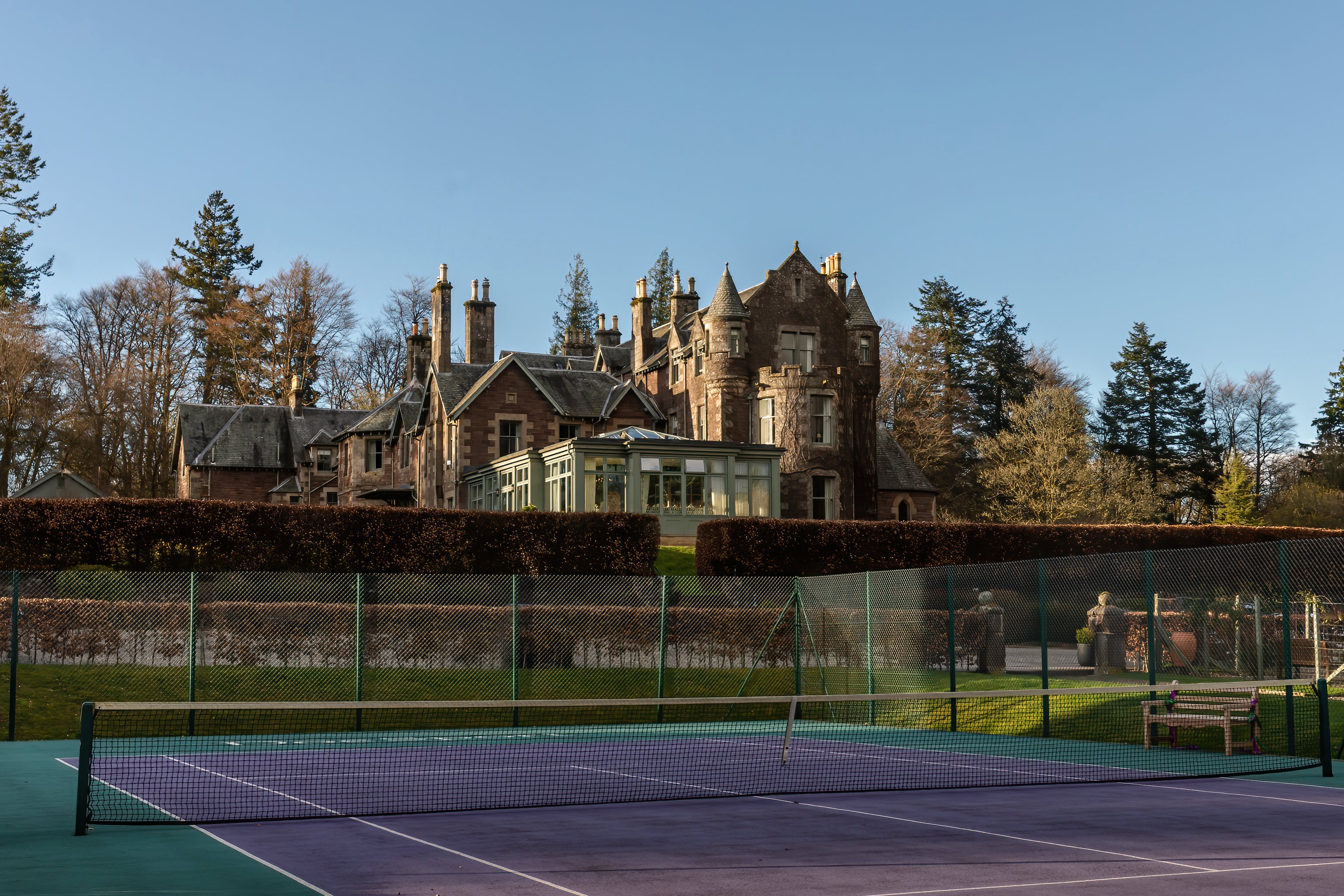 The tennis court at Andy Murray’s Cromlix hotel is Wimbledon green and purple (Cromlix)