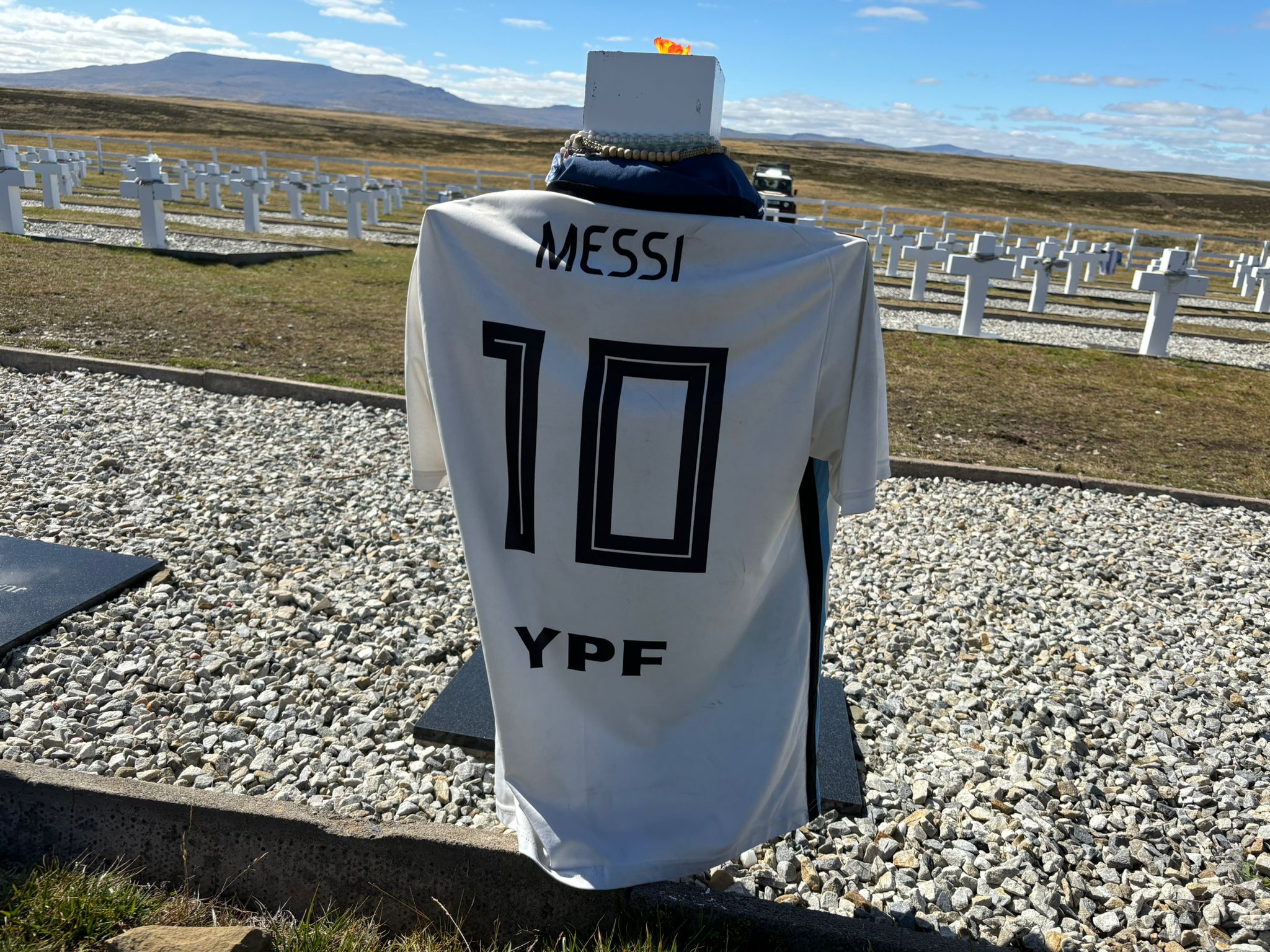 Crosses for 15-year-old conscripts from the Falklands war in 1982 are draped in shirts of Argentina (Paul Howard)
