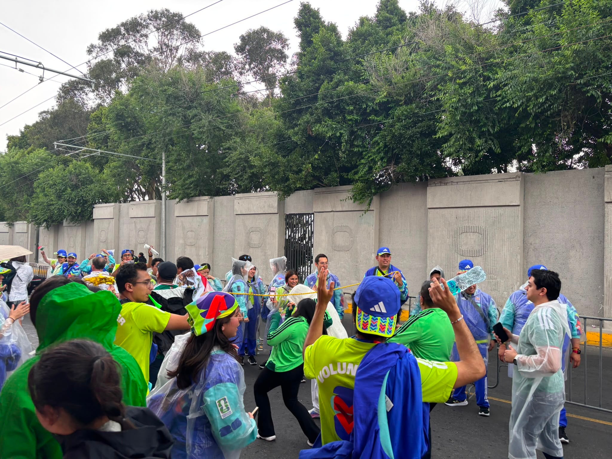 World Cup volunteers form a 'Limbo' dance scene for passers-by in Mexico City