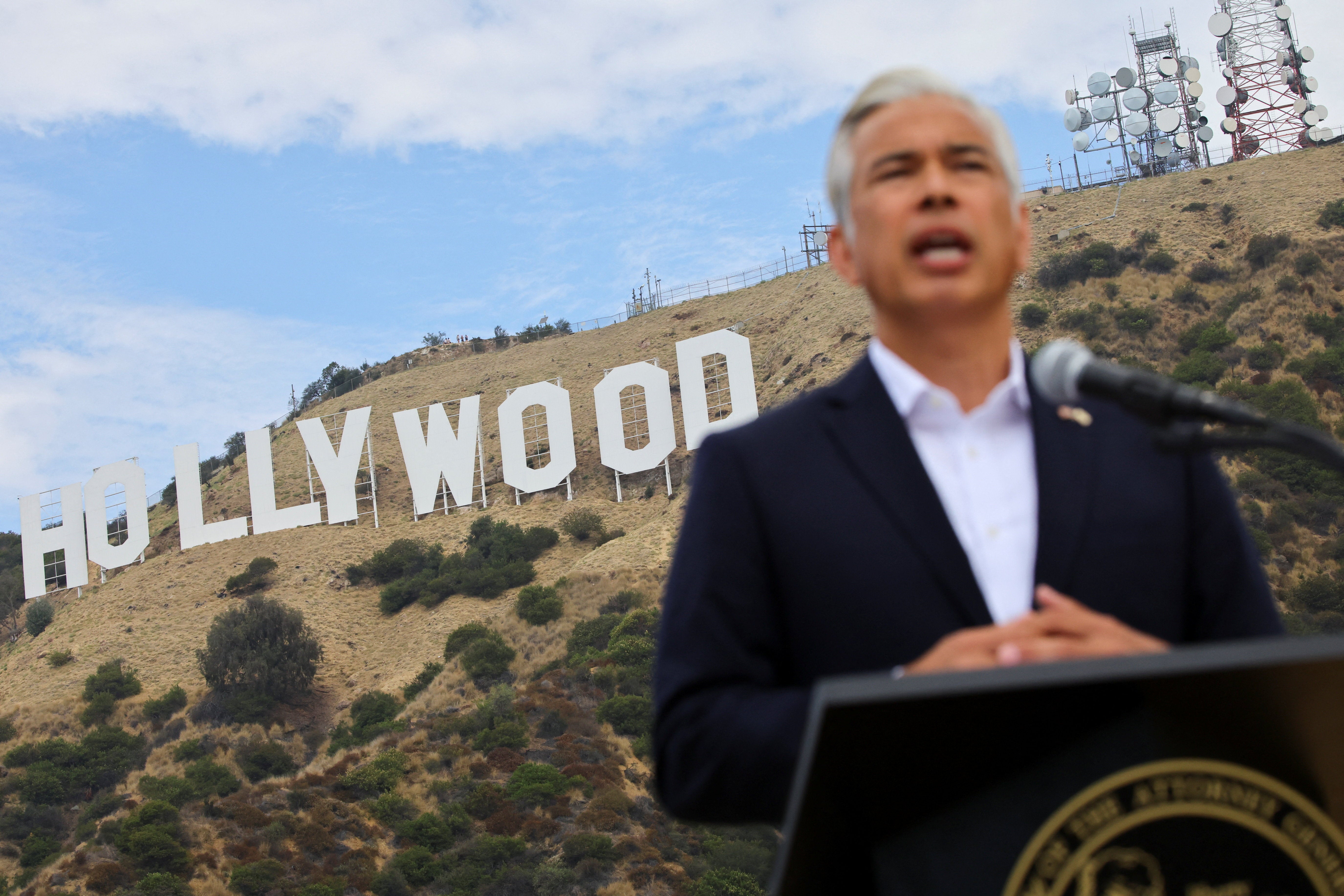 California Attorney General Rob Bonta holds a press conference next to the iconic Hollywood Sign, as he announces California will sue to block Paramount's $110 billion acquisition of Warner Bros.