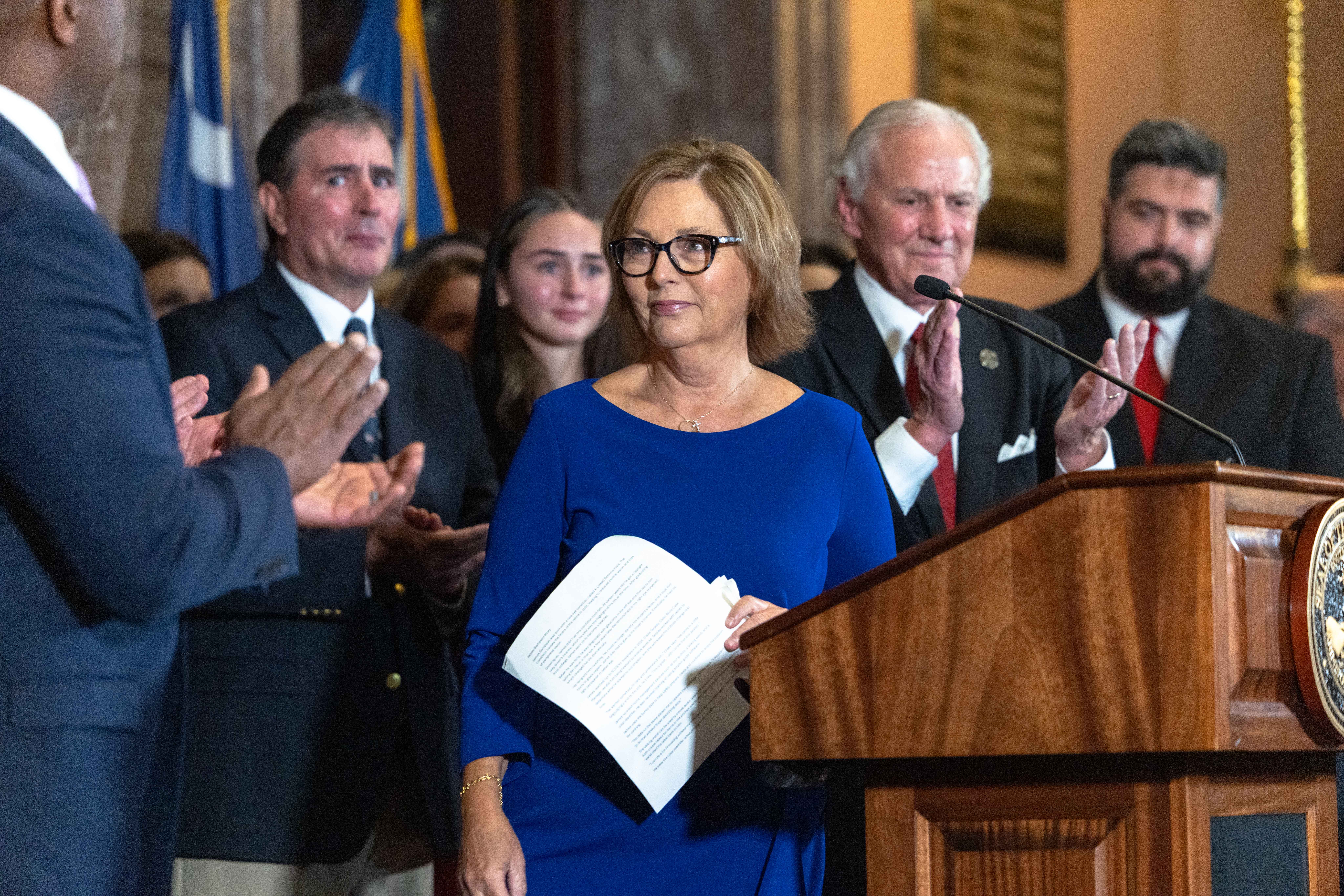 Darline Graham Nordone at a press conference with South Carolina Gov. Henry McMaster