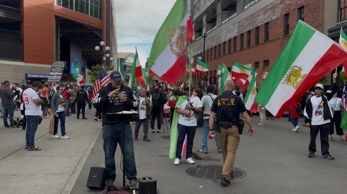 An anti-Iranian regime march comes across a Christian preacher in Seattle