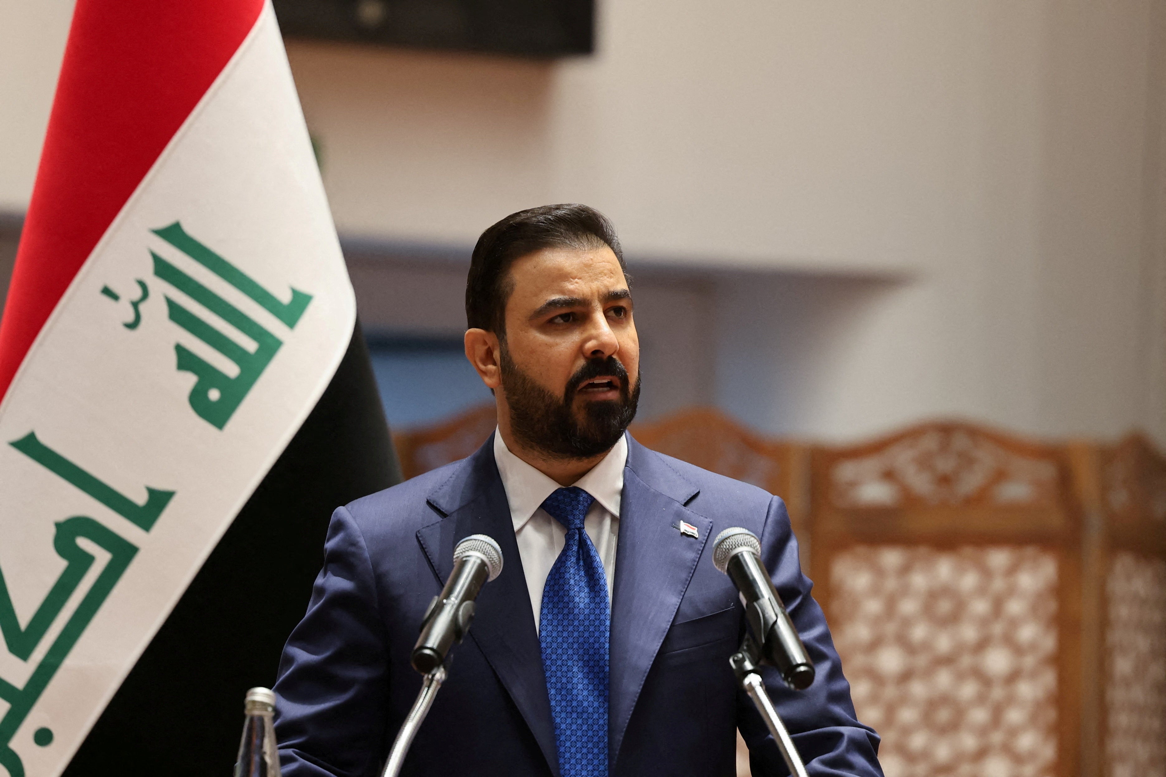 Iraqi Prime Minister-designate Ali al-Zaidi speaks during a parliamentary session to vote in a new government headed by Ali al-Zaidi as prime minister, at the parliament headquarters in Baghdad, Iraq, May 14, 2026