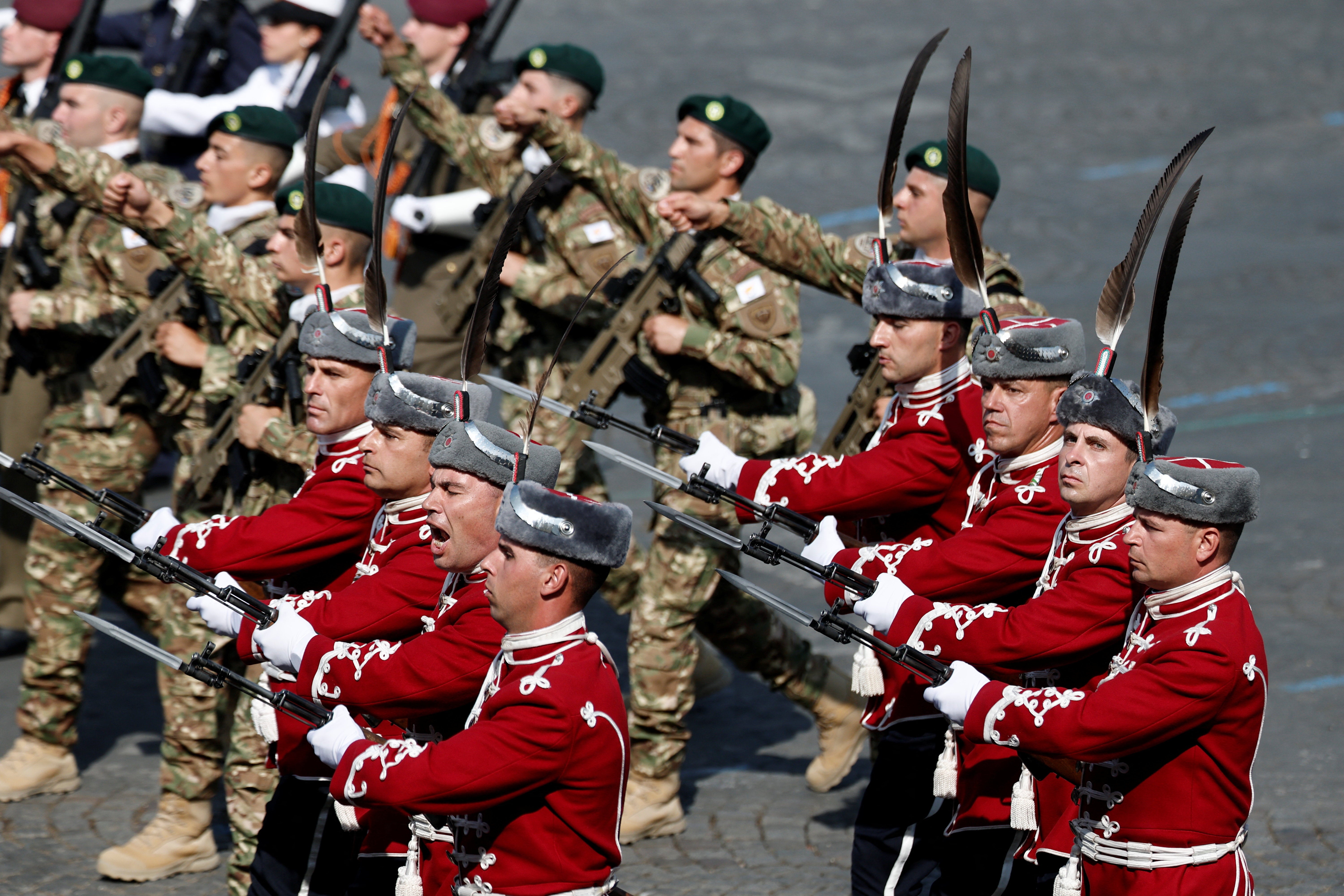 Bulgarian troops march with soldiers from countries of the Coalition of the Willing during the annual Bastille Day military parade on the Champs-Elysees avenue in Paris