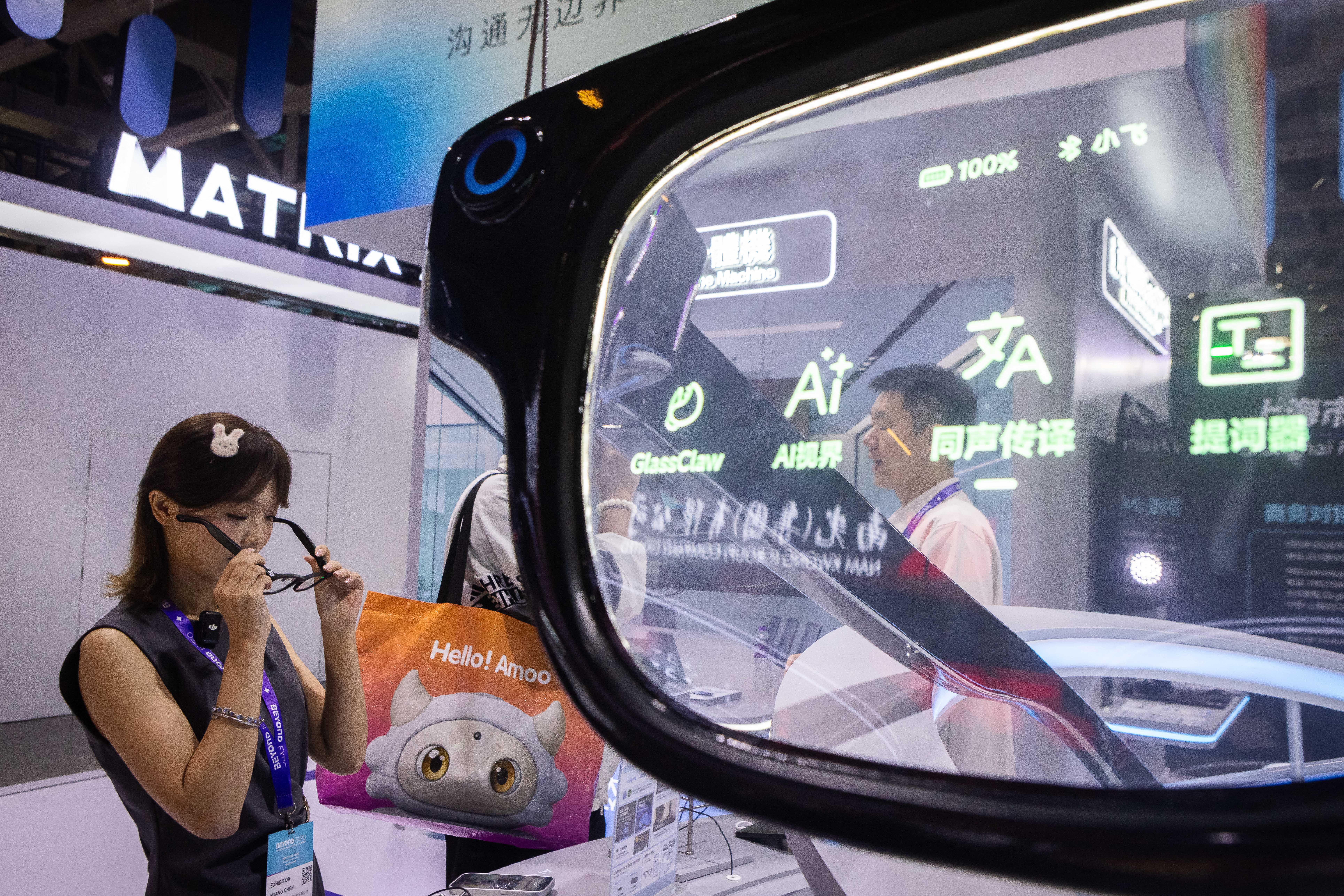 A visitor tests AI smartglasses during the Beyond Expo technology exhibition in Macau on May 29, 2026. (Photo by Eduardo Leal / AFP via Getty Images) (AFP/Getty)