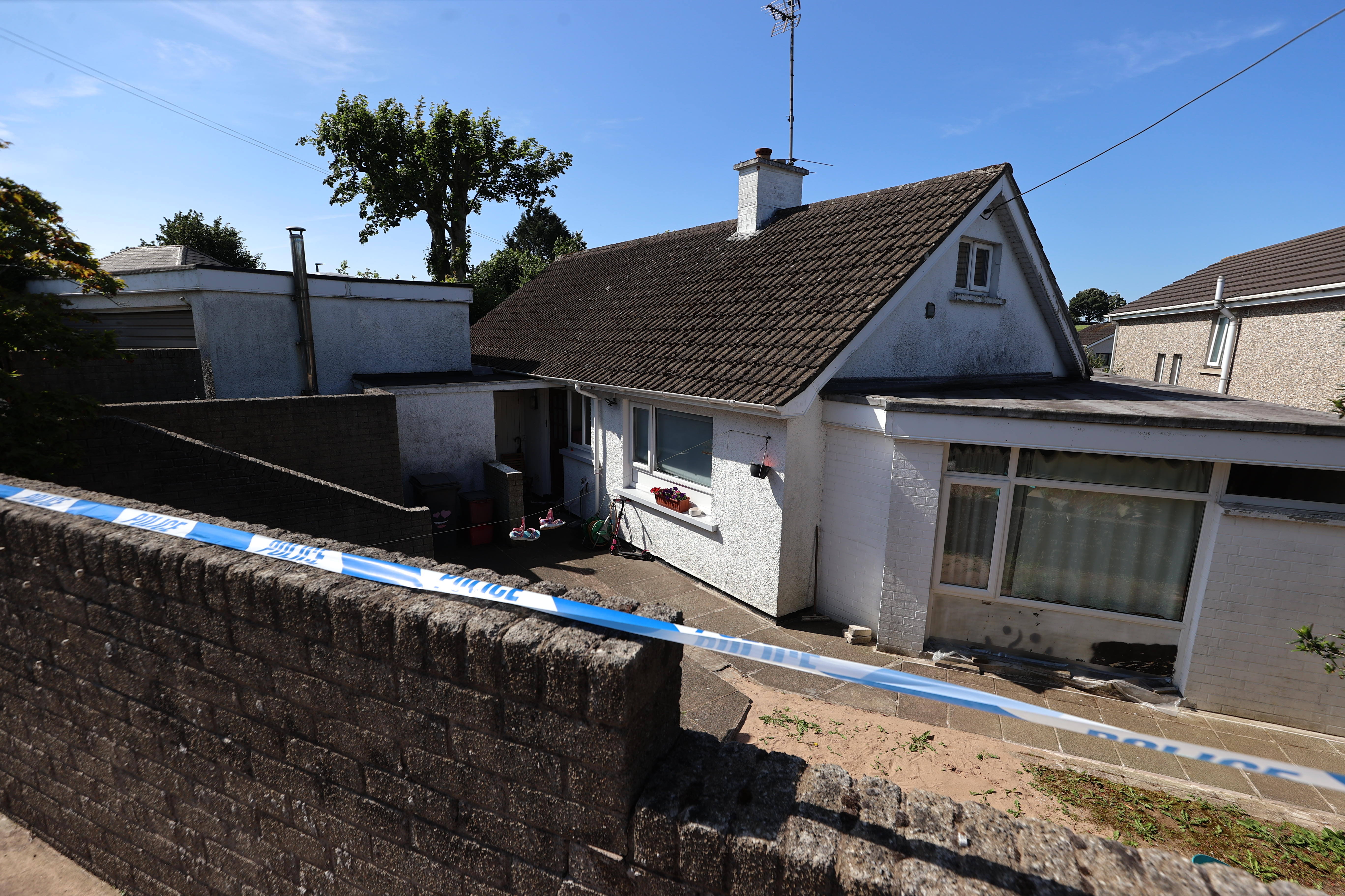 A police cordon at the scene in the Old Cullybackey Road area of Ballymena, Co Antrim (Liam McBurney/PA) (PA Wire)